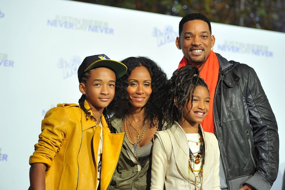Will Smith smiling with his family.