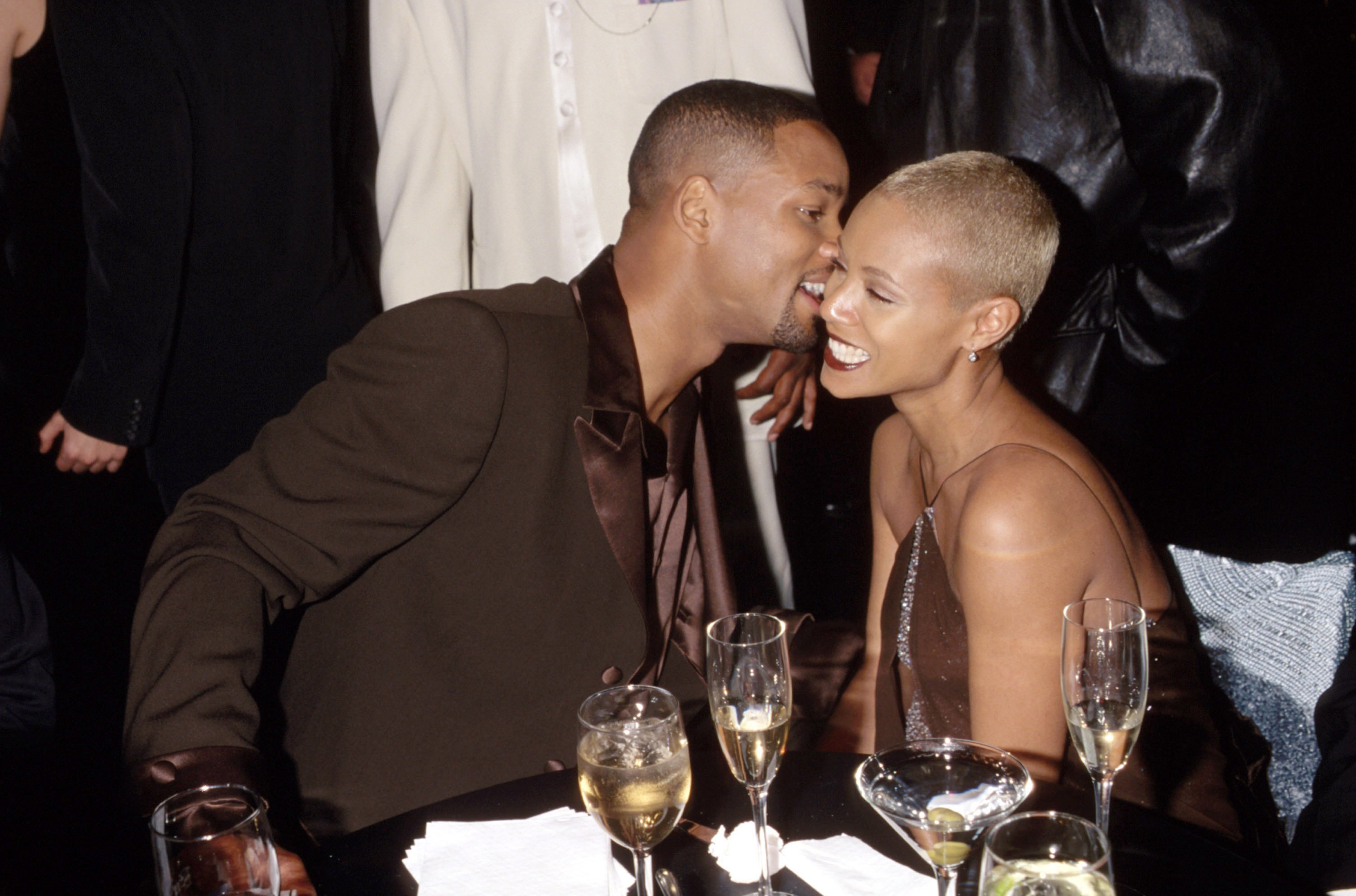 Will Smith whispers into Jada Pinkett Smith's ear at a NAACP dinner