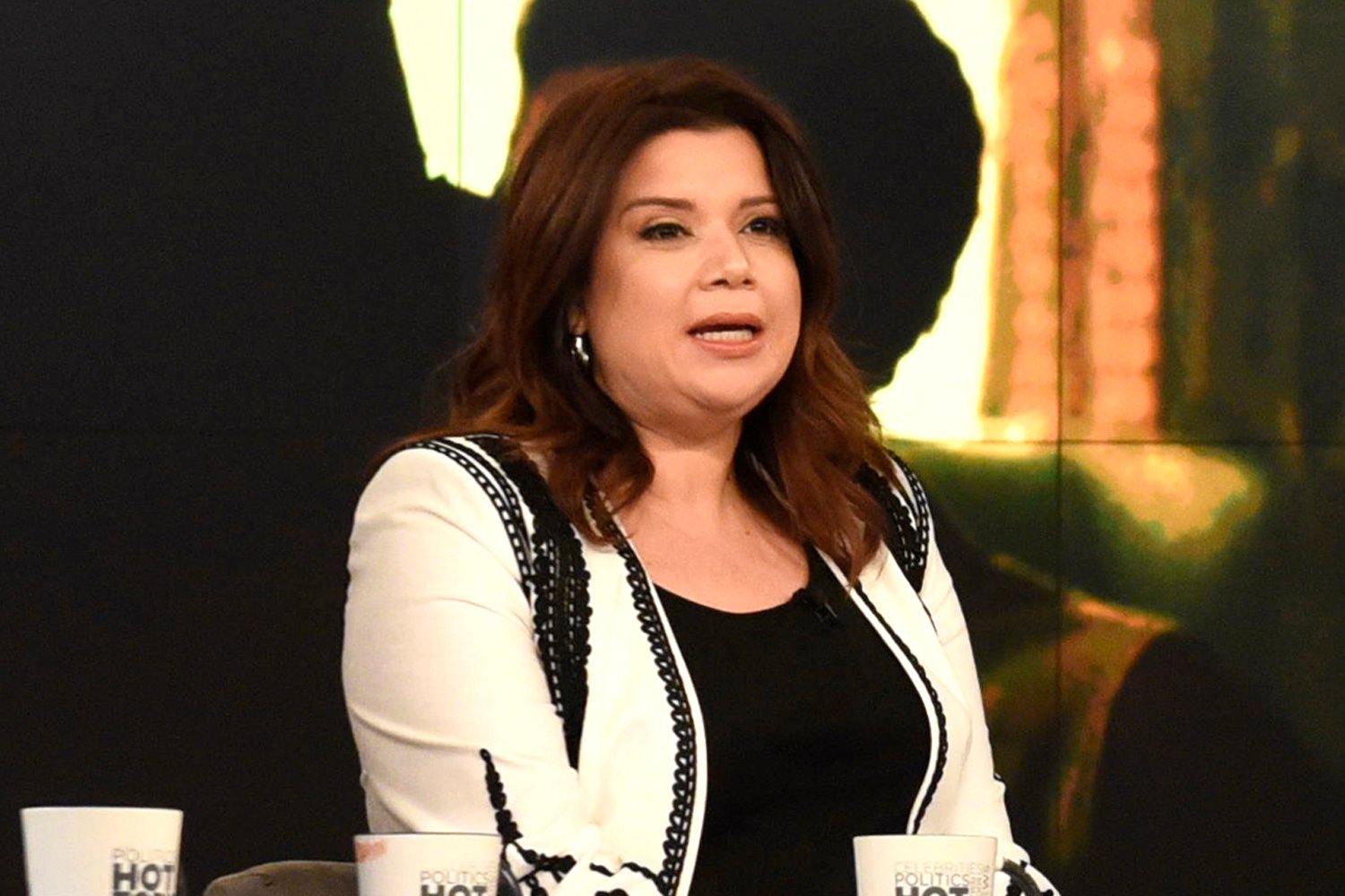 Ana Navarro wearing a black shirt and white jacket during an episode of 'The View'