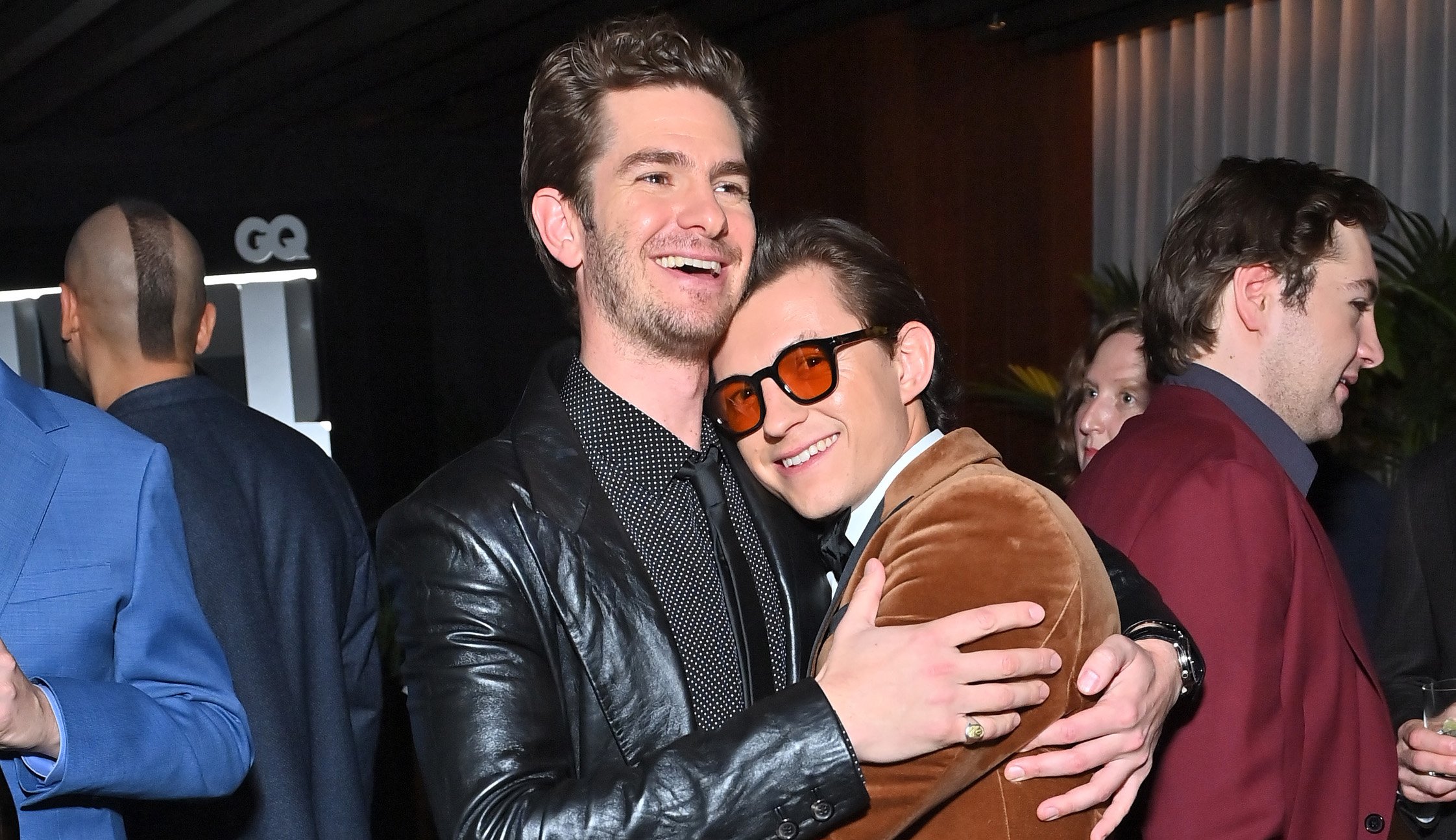 Spider-Man stars Andrew Garfield and Tom Holland hugging at the 2021 GQ Men of the Year Party