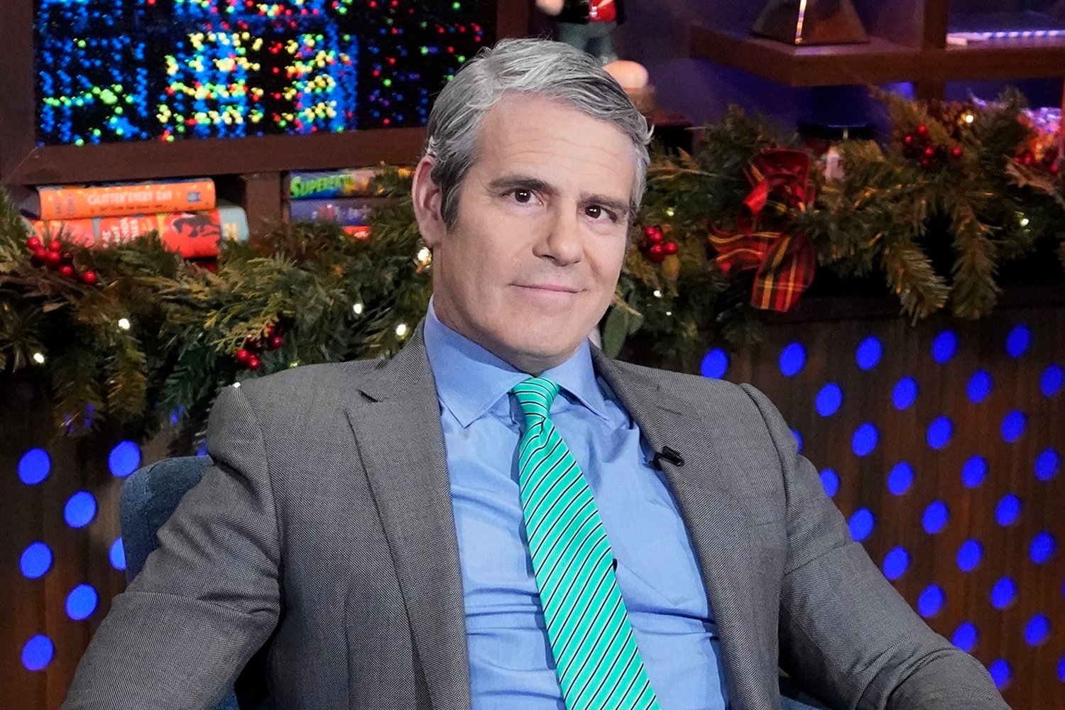 Andy Cohen smirks on the set of 'Watch What Happens Live'