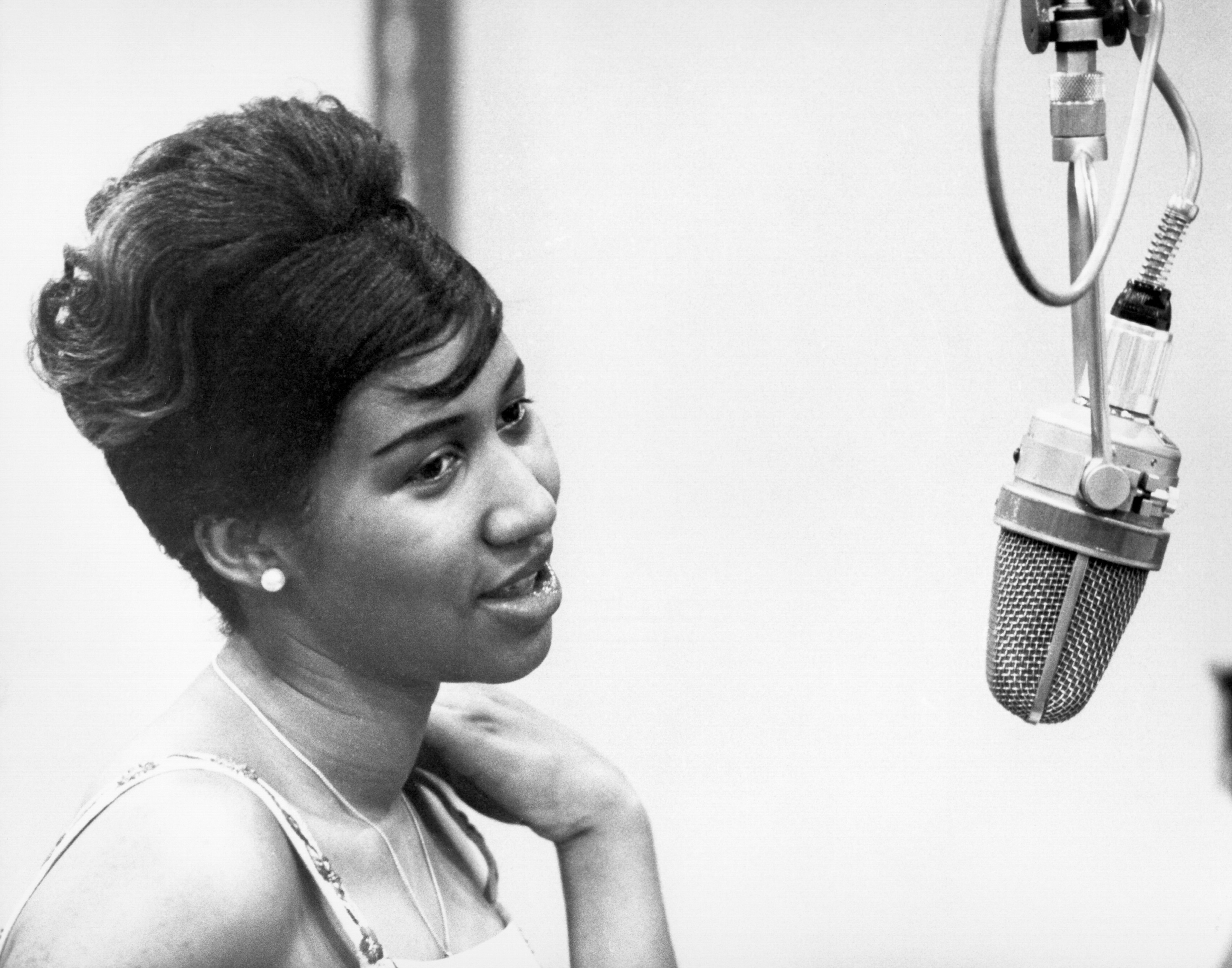 Aretha Franklin near a microphone