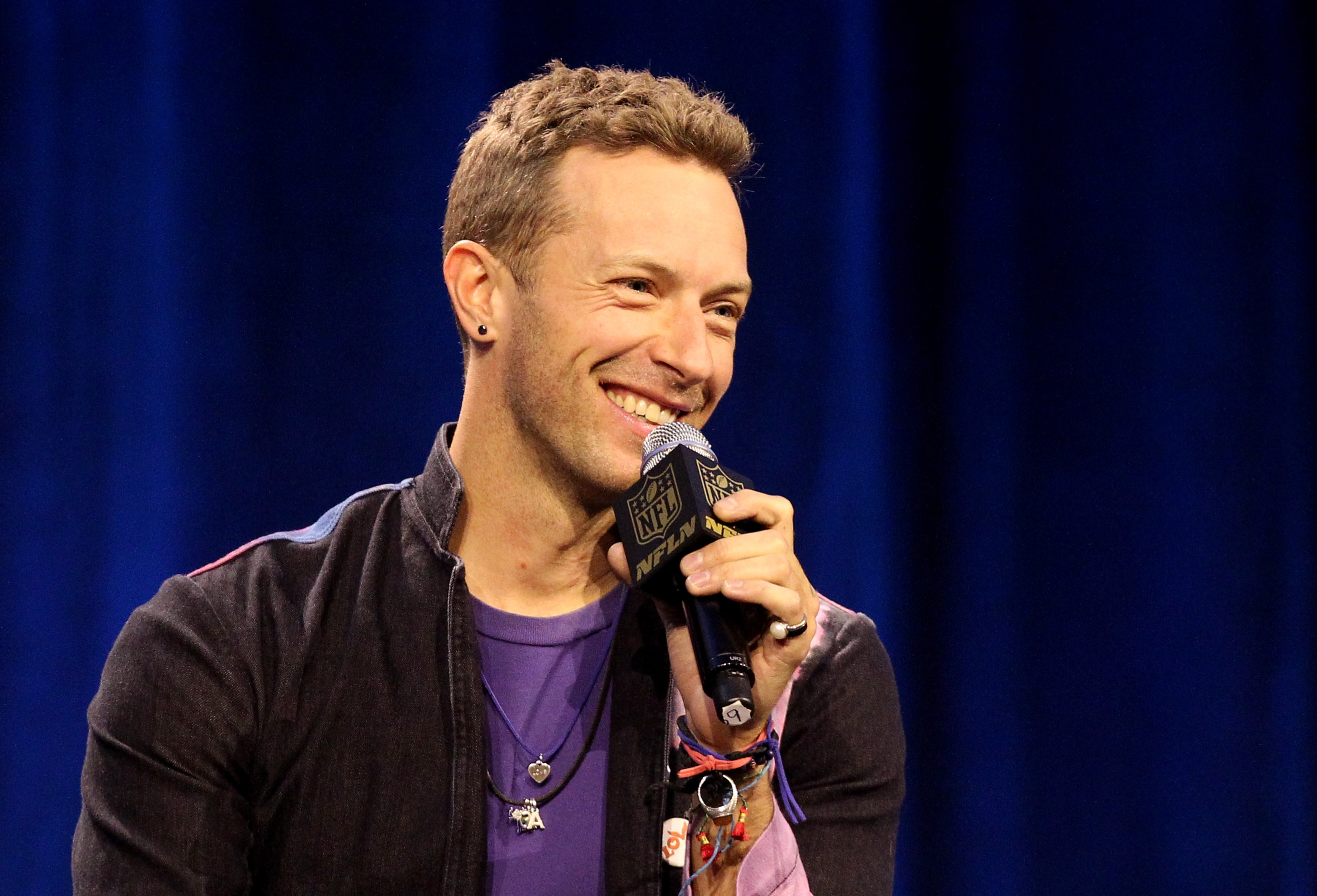 Chris Martin of Coldplay with a microphone