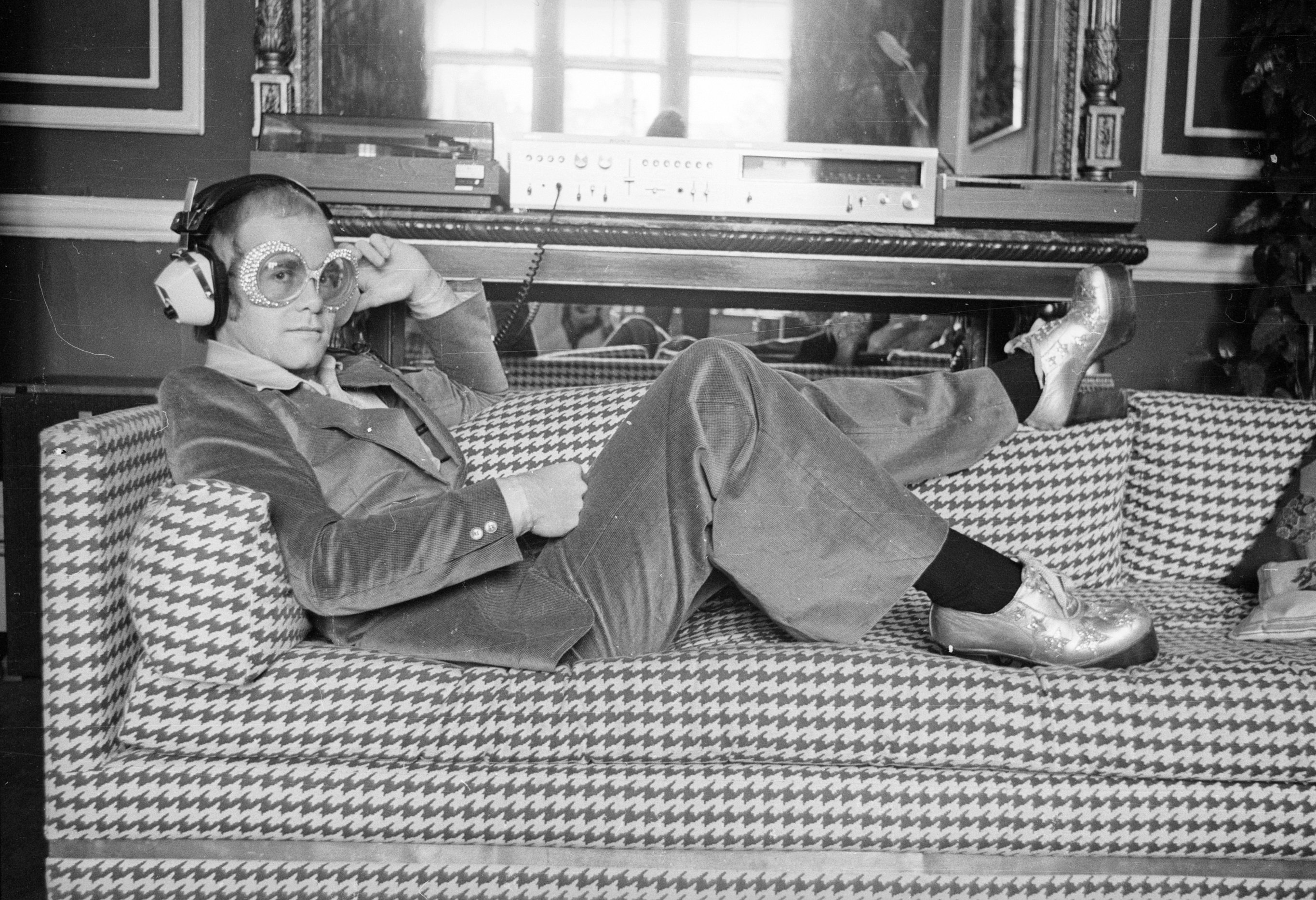 Elton John on a couch