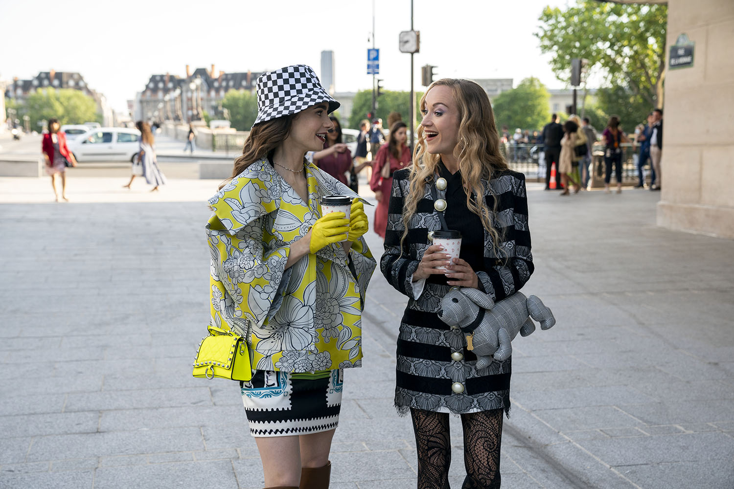 Lily Collins as Emily and Daria Panchenko as Petra chatting with each other in Emily in Paris Season 2.