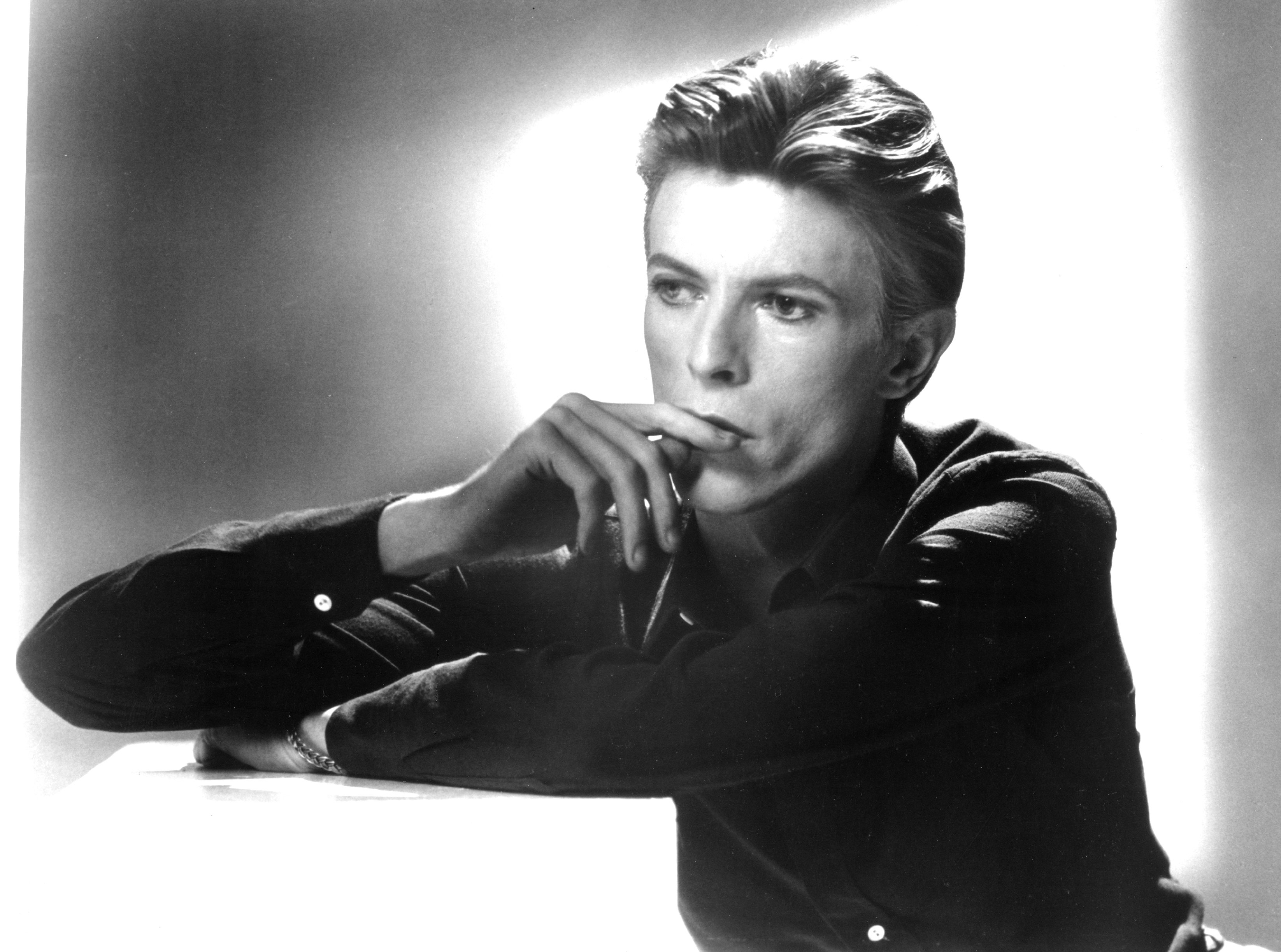 David Bowie with his finger on his lip