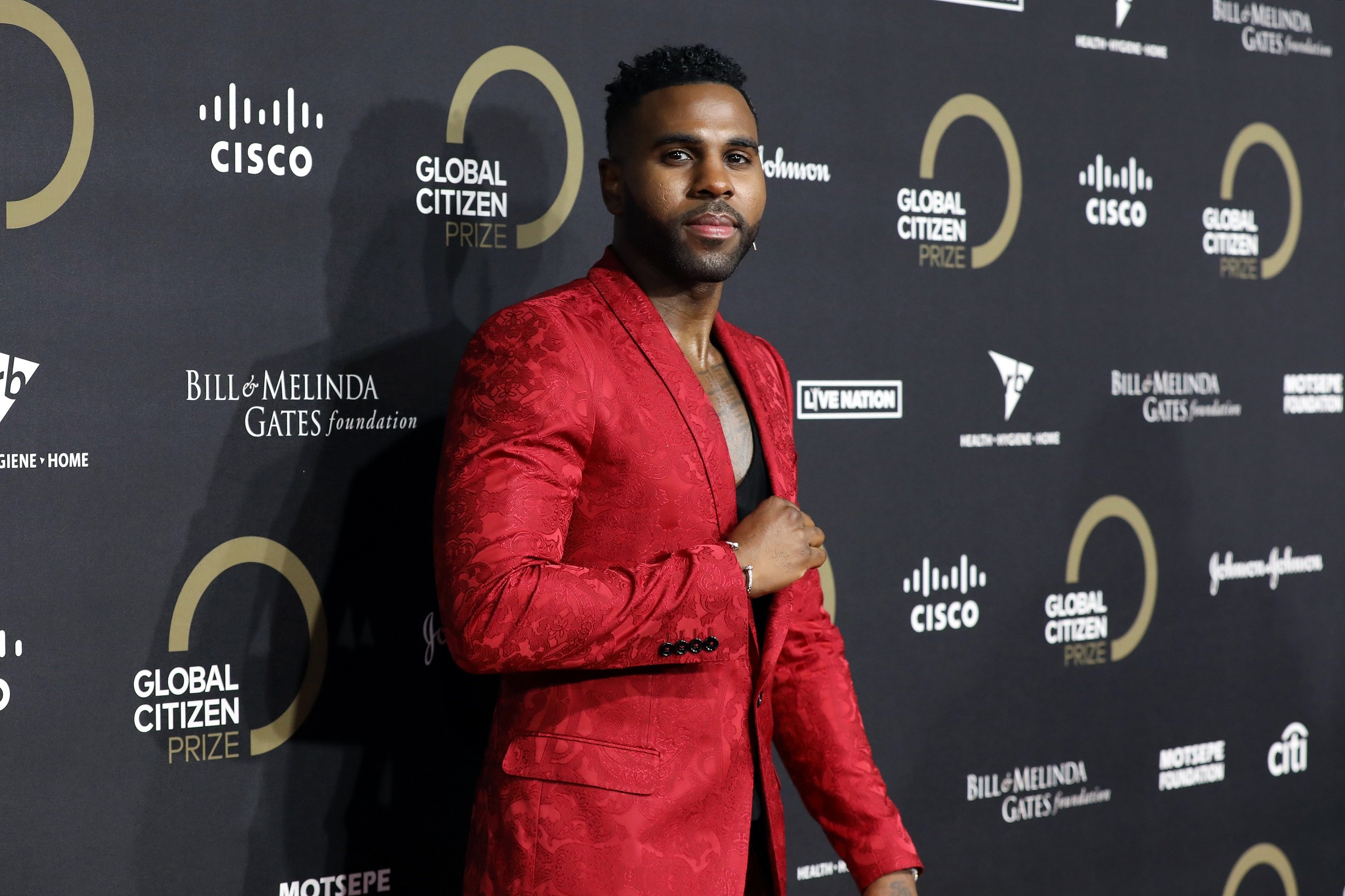 Jason Derulo wearing a red outfit