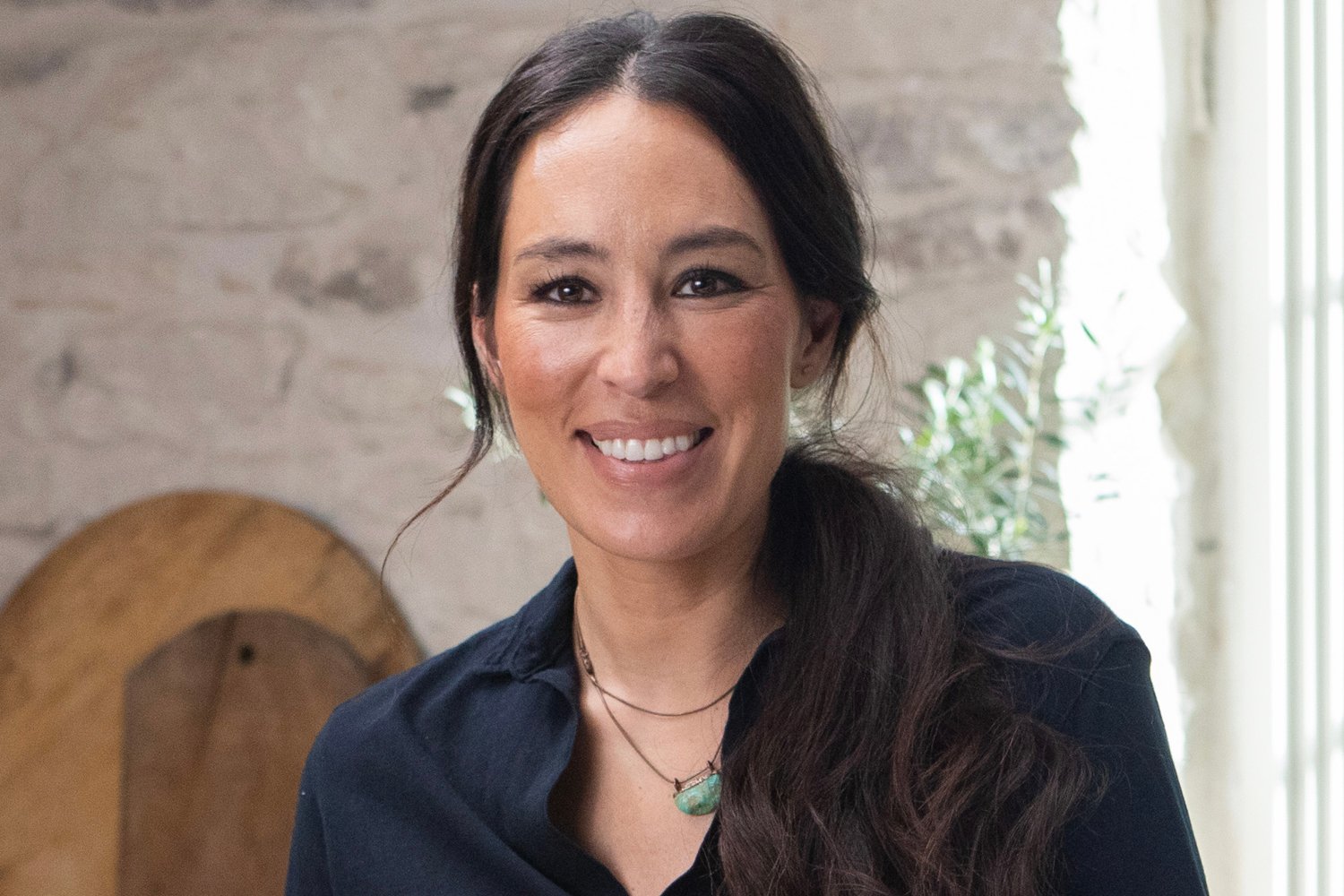 Joanna Gaines smiling on the set of 'Magnolia Table'