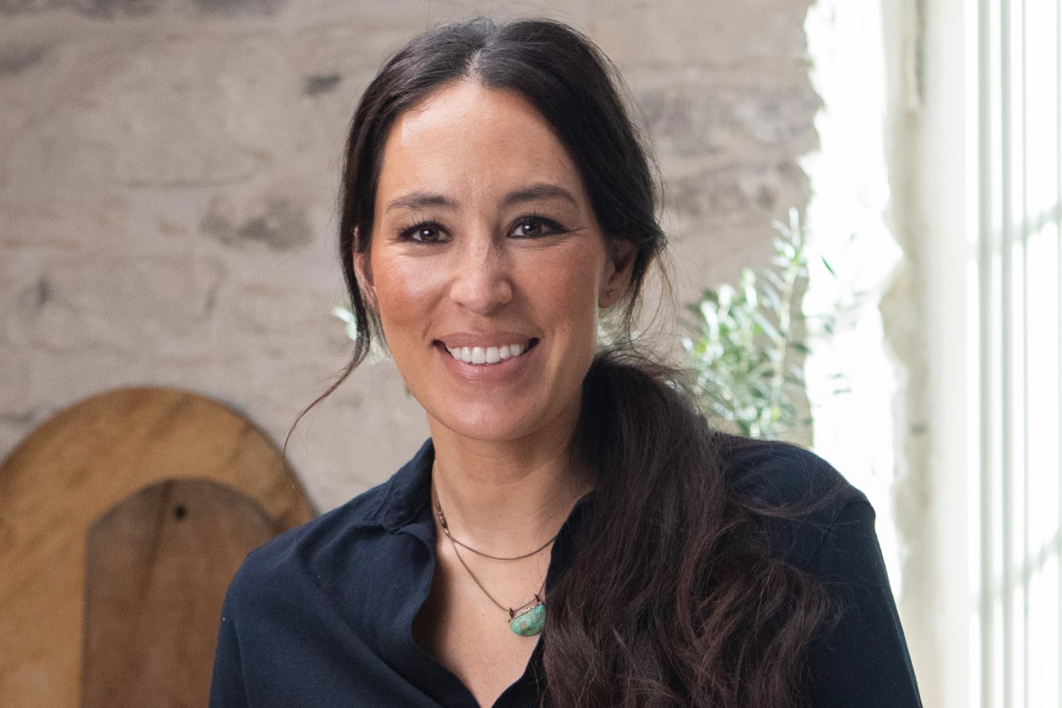 Joanna Gaines posing a smile on the set of 'Magnolia Table'