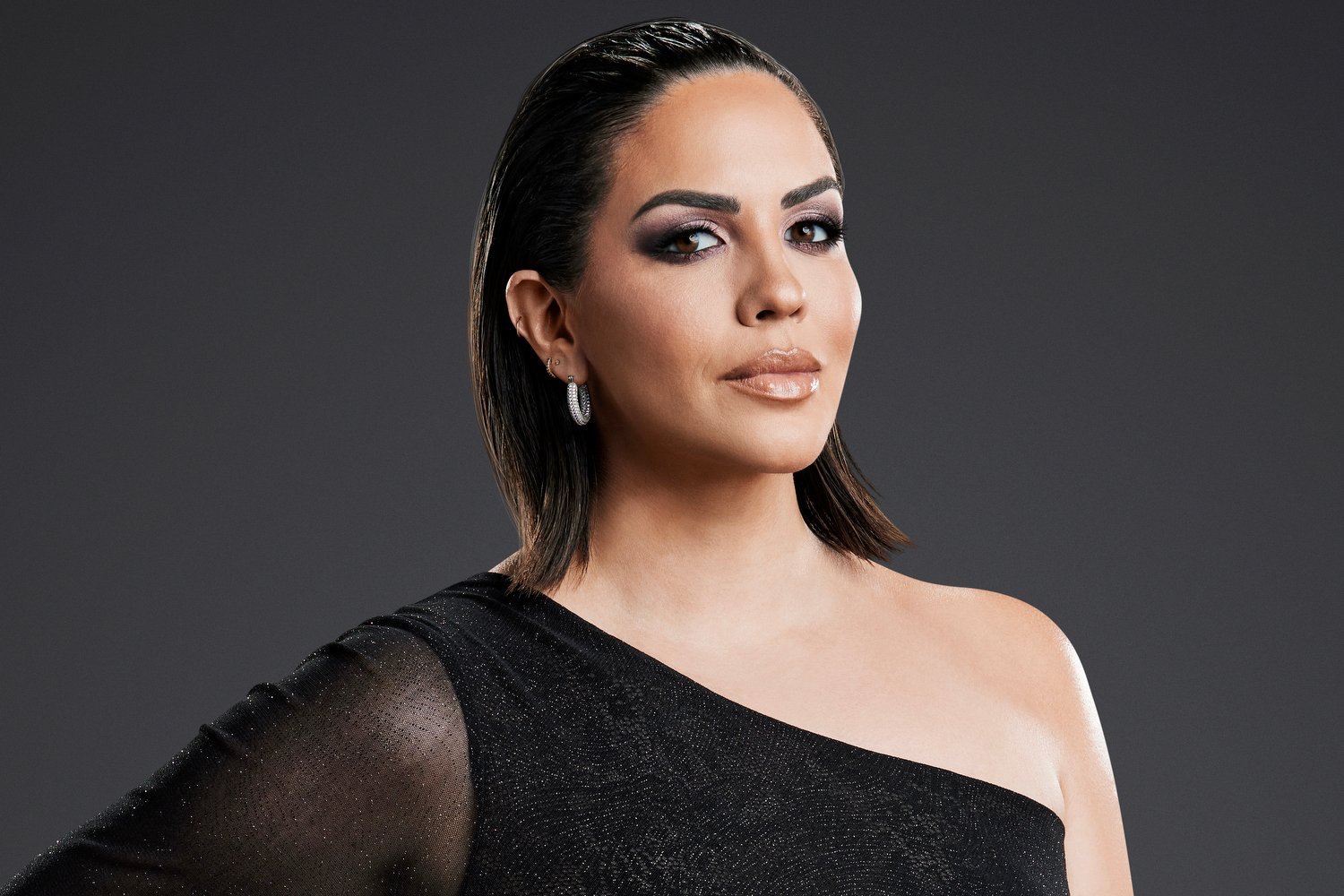 Katie Maloney poses for 'Vanderpump Rules' photoshoot wearing dark shades of makeup and sporting slicked back hair