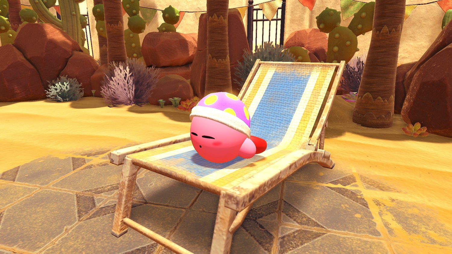 Kirby sleeps on a lounge chair in Kirby and the Forgotten Land on Nintendo Switch