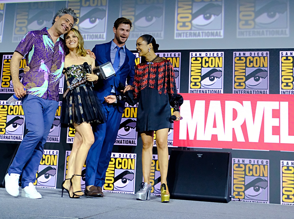 (L-R) Director Taika Waititi with 'Thor: Love and Thunder' stars Natalie Portman, Chris Hemsworth, and Tessa Thompson at the Marvel panel during San Diego Comic Con 2019.