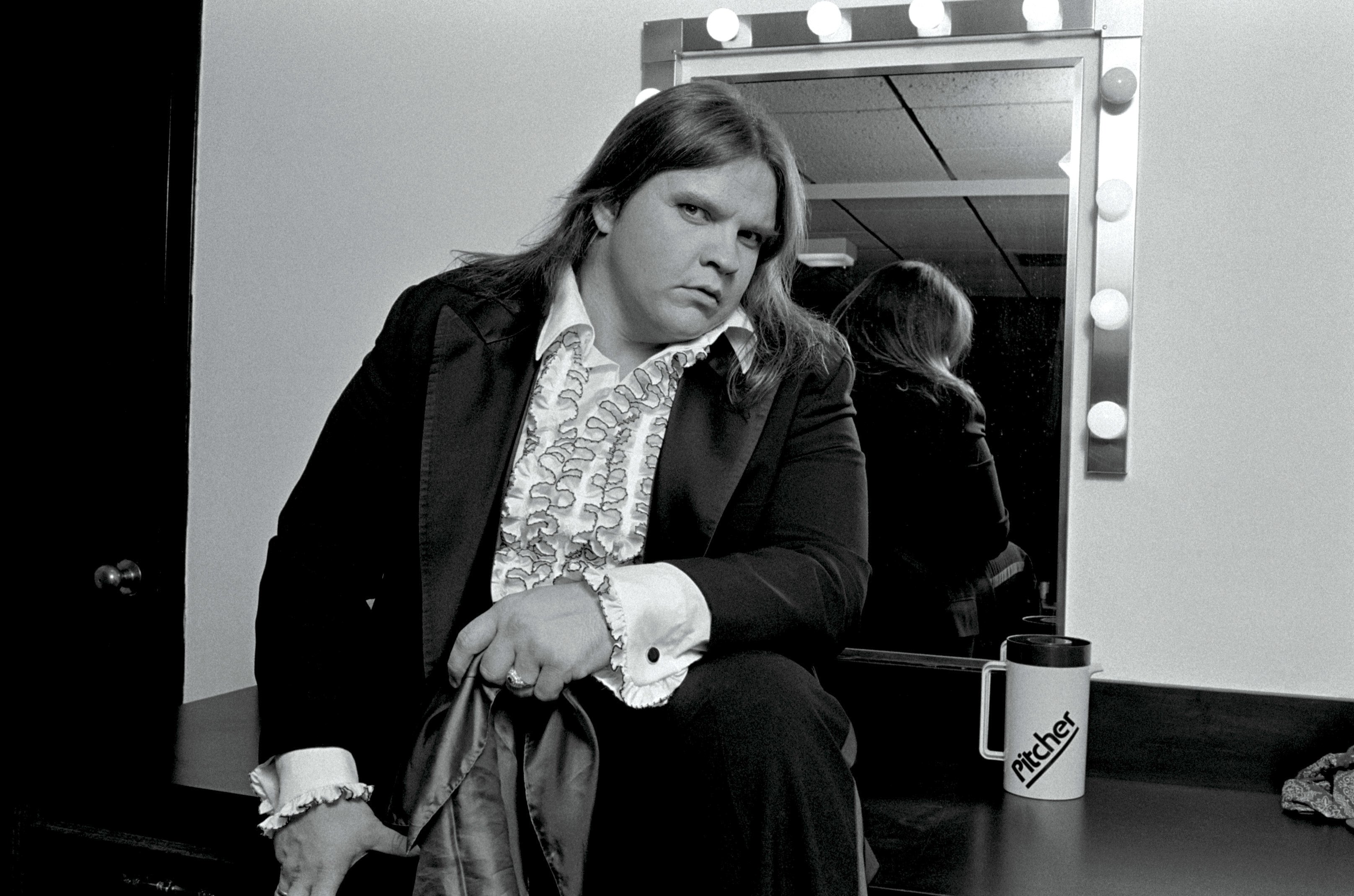 Meat Loaf in front of a mirror