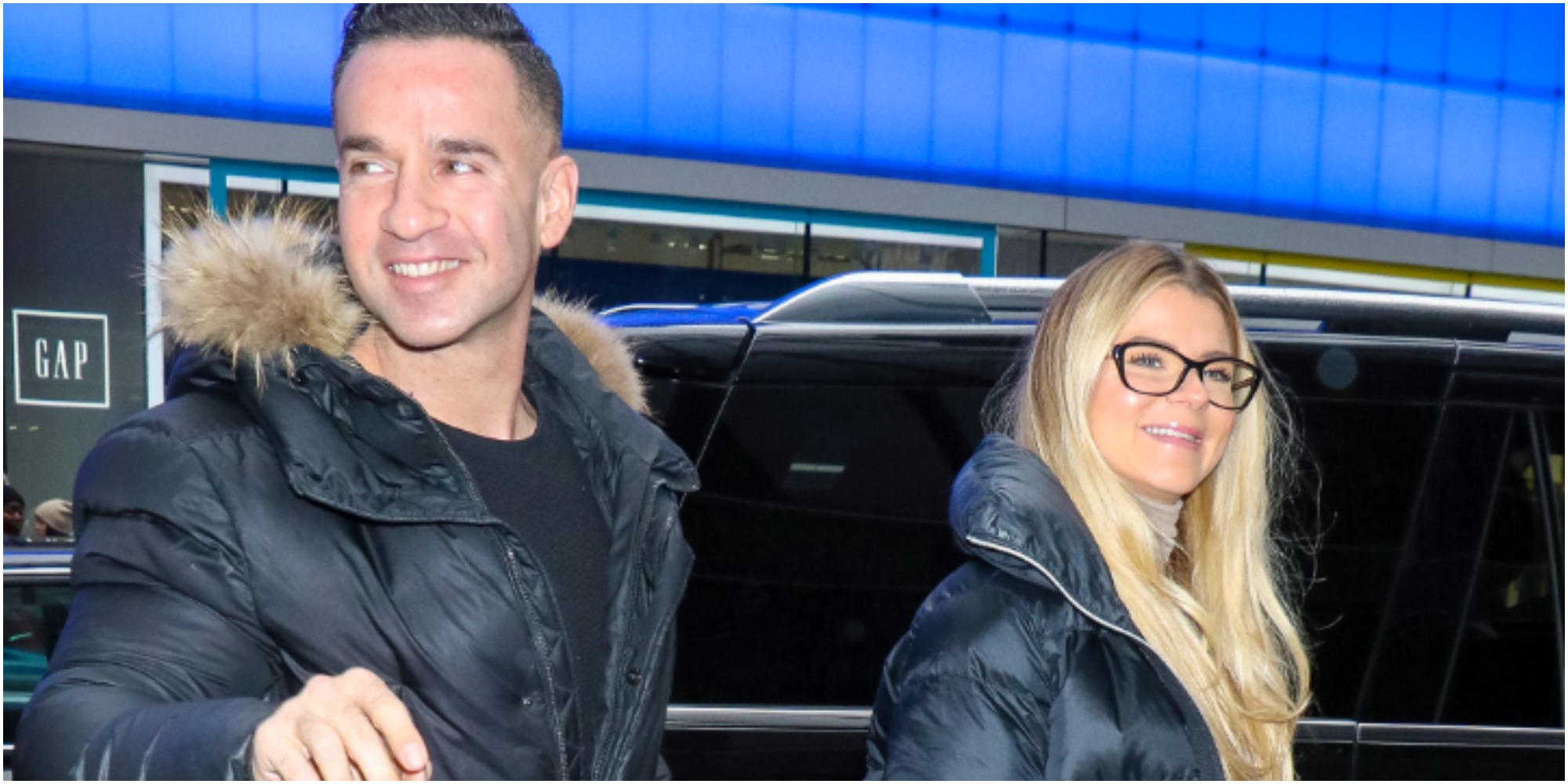 Mike Sorrentino and Lauren Sorrentino pose for photographers.