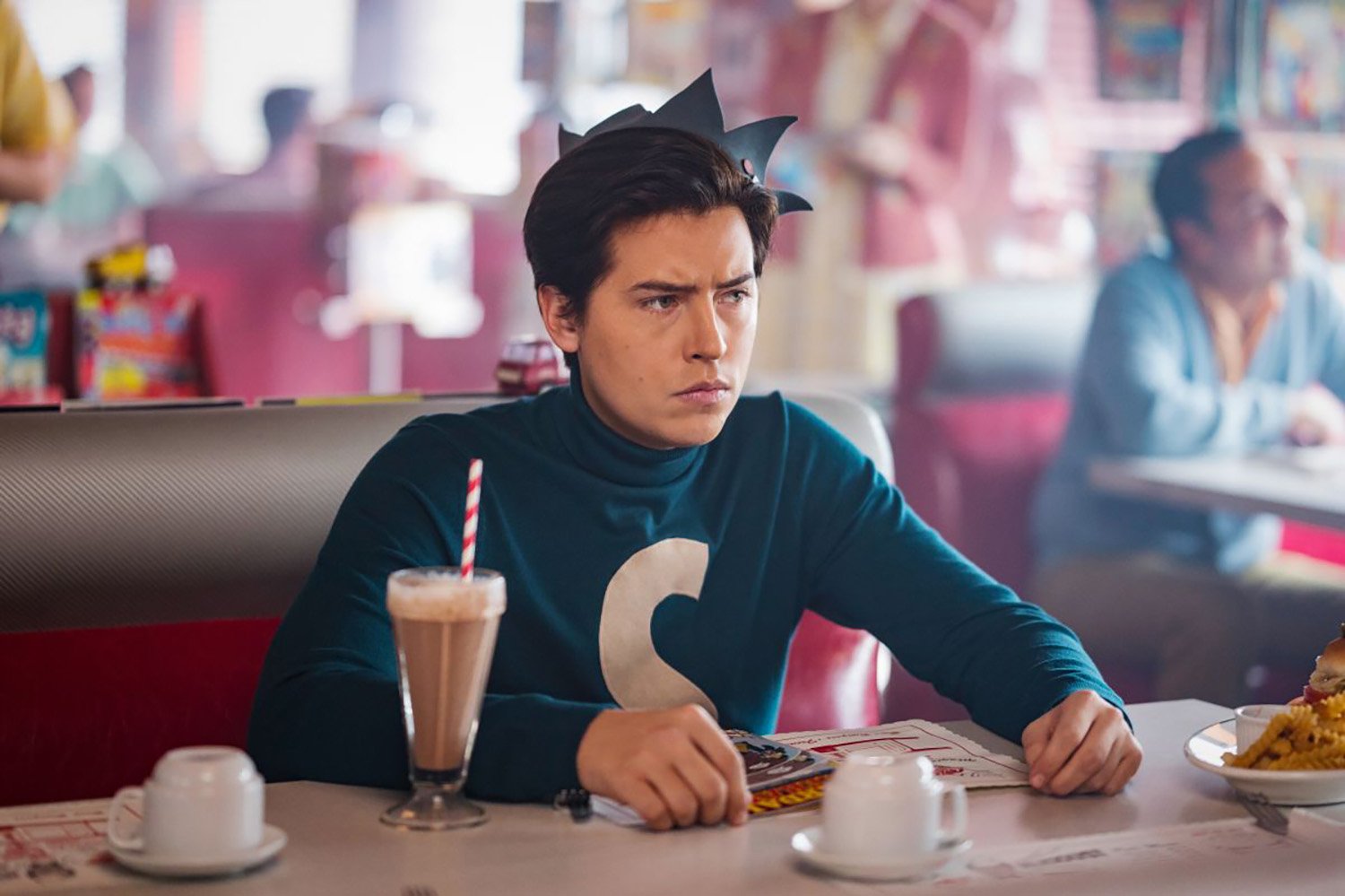 Cole Sprouse as Jughead Jones wearing his Archie Comics attire in Riverdale Season 6