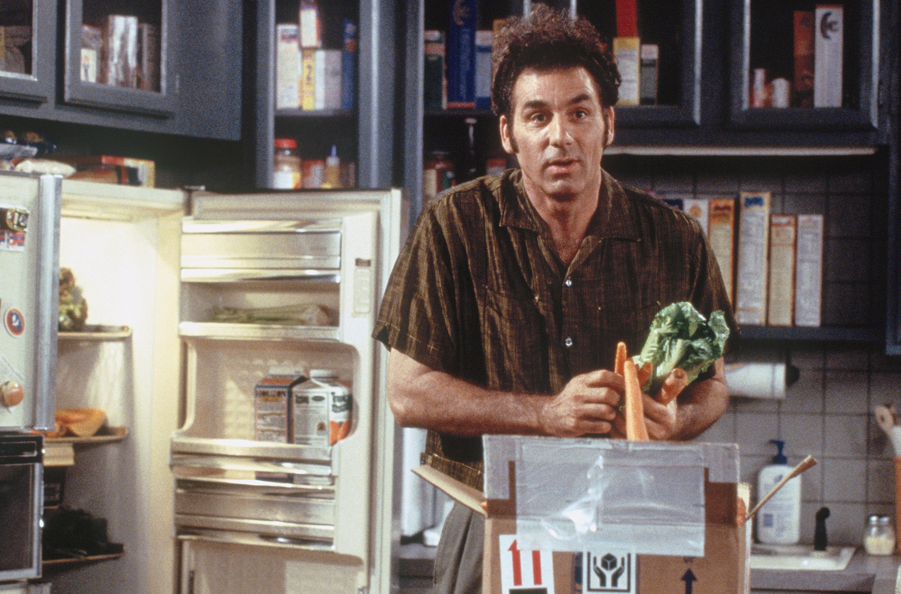 Cosmo Kramer stands in Jerry's kitchen during an episode of 'Seinfeld'