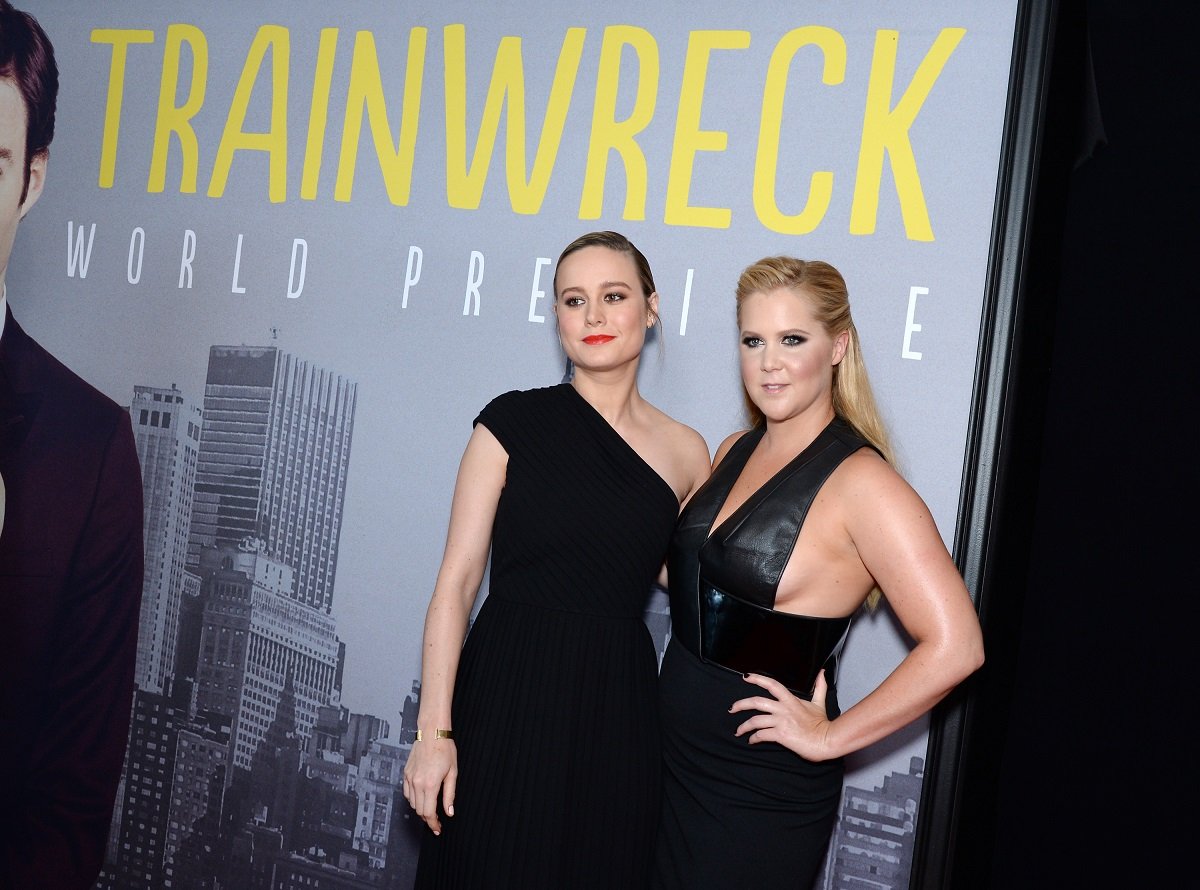 Brie Larson (L) and Amy Schumer post together at the 'Trainwreck' premiere