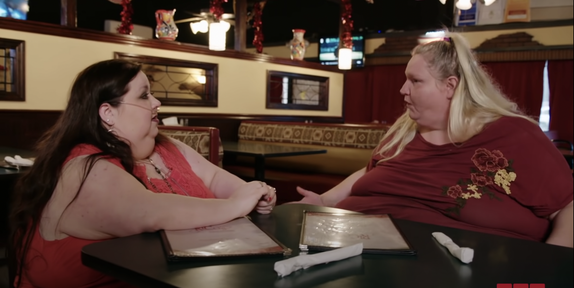 Meghan Crumpler and Vannessa Cross from '1000-lb Best Friends' talking to each other across a table