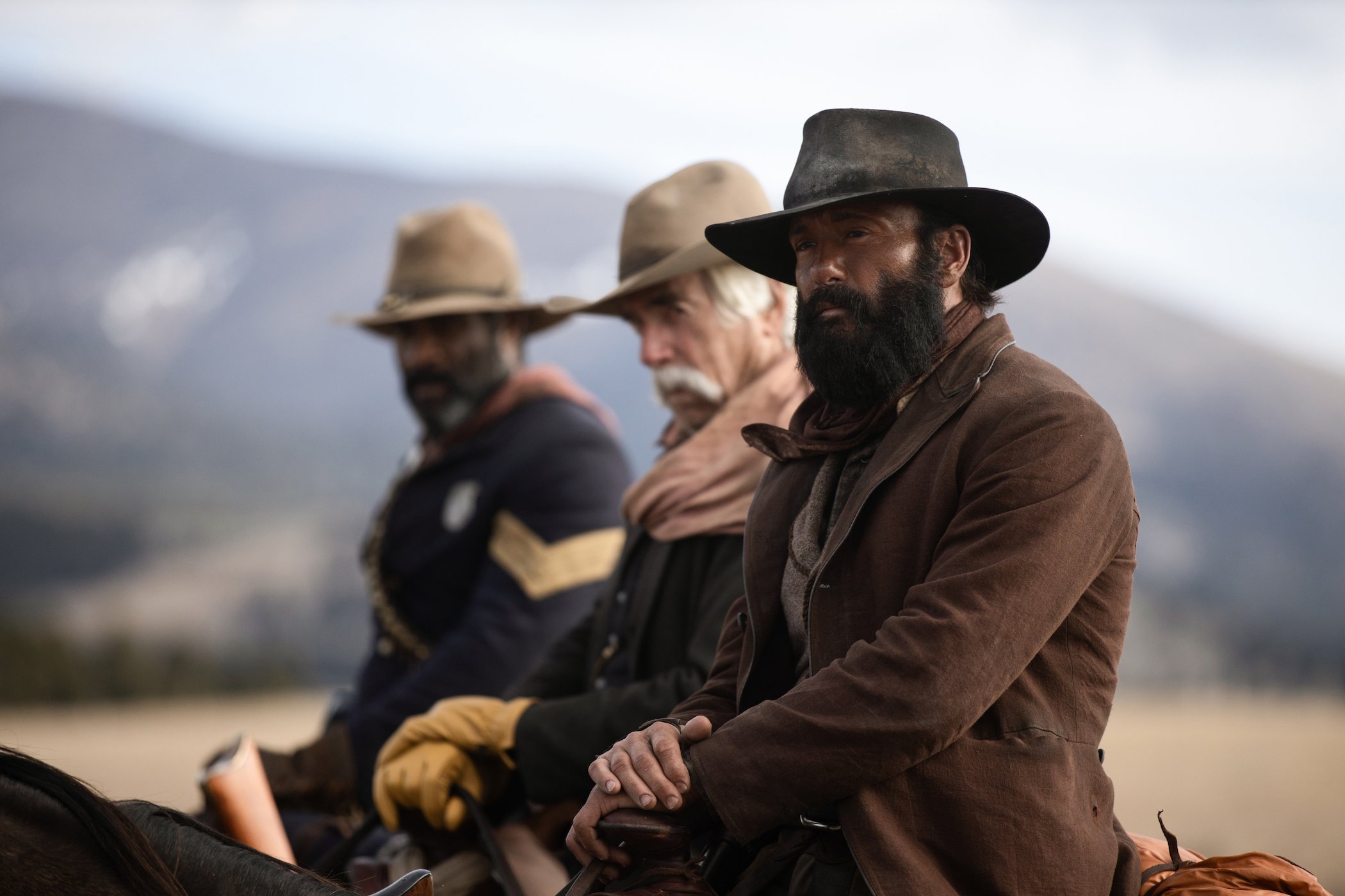 Tim McGraw as James Dutton, Sam Elliott as Shea, and LaMonica Garrett as Thomas sitting on horses in '1883' episode 9