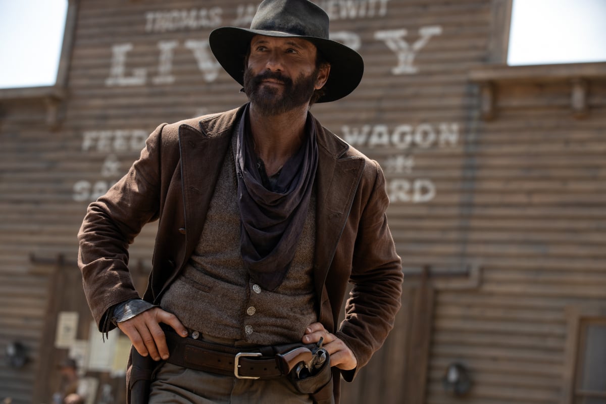 Tim McGraw as James on the set designed by the 1883 crew. James stands in front of the Livery Stable. 
