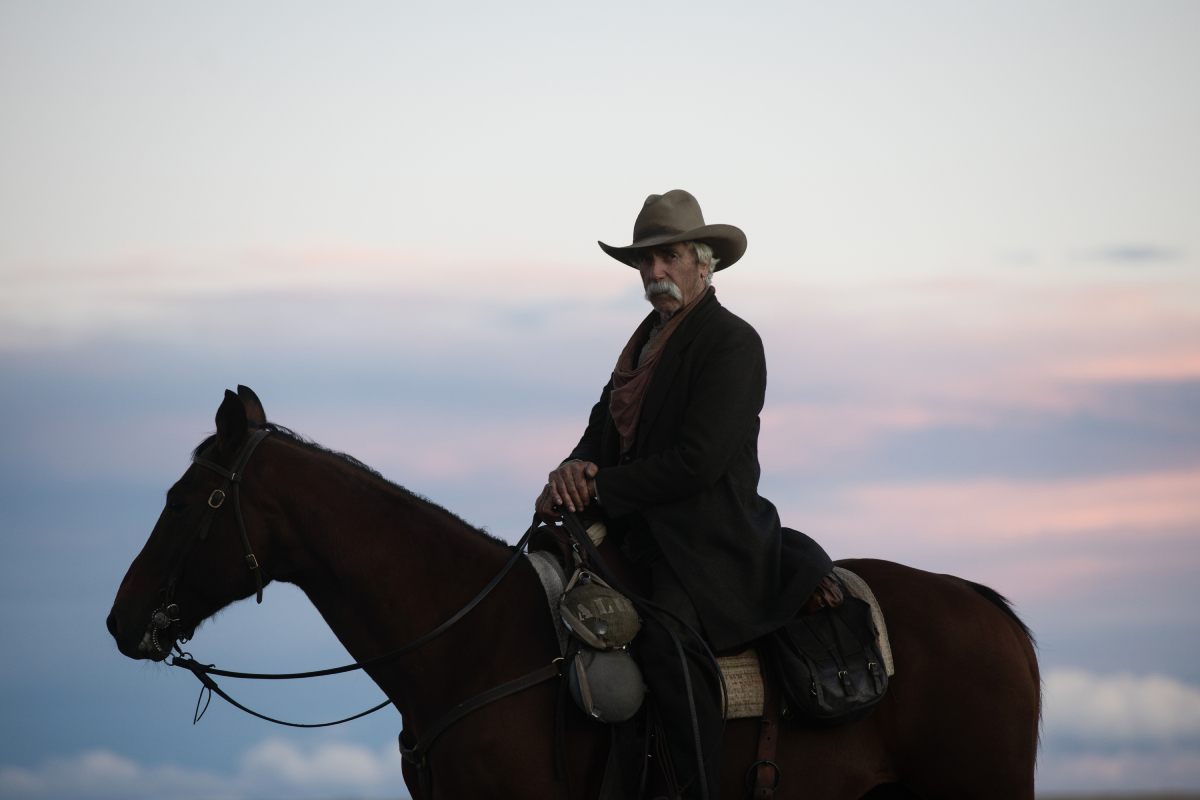 Sam Elliott as Shea in the 1883 finale. Shea sits on his horse wearing a cowboy hat.