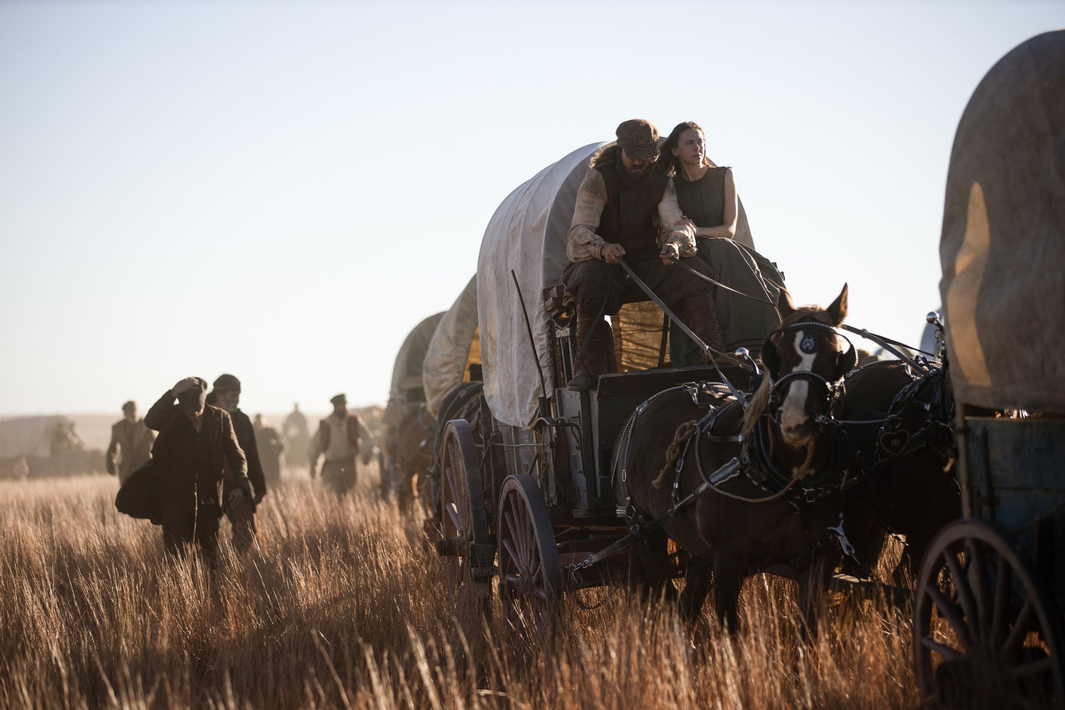 The immigrants traveling across the Great Plains with horses and carriages in '1883'