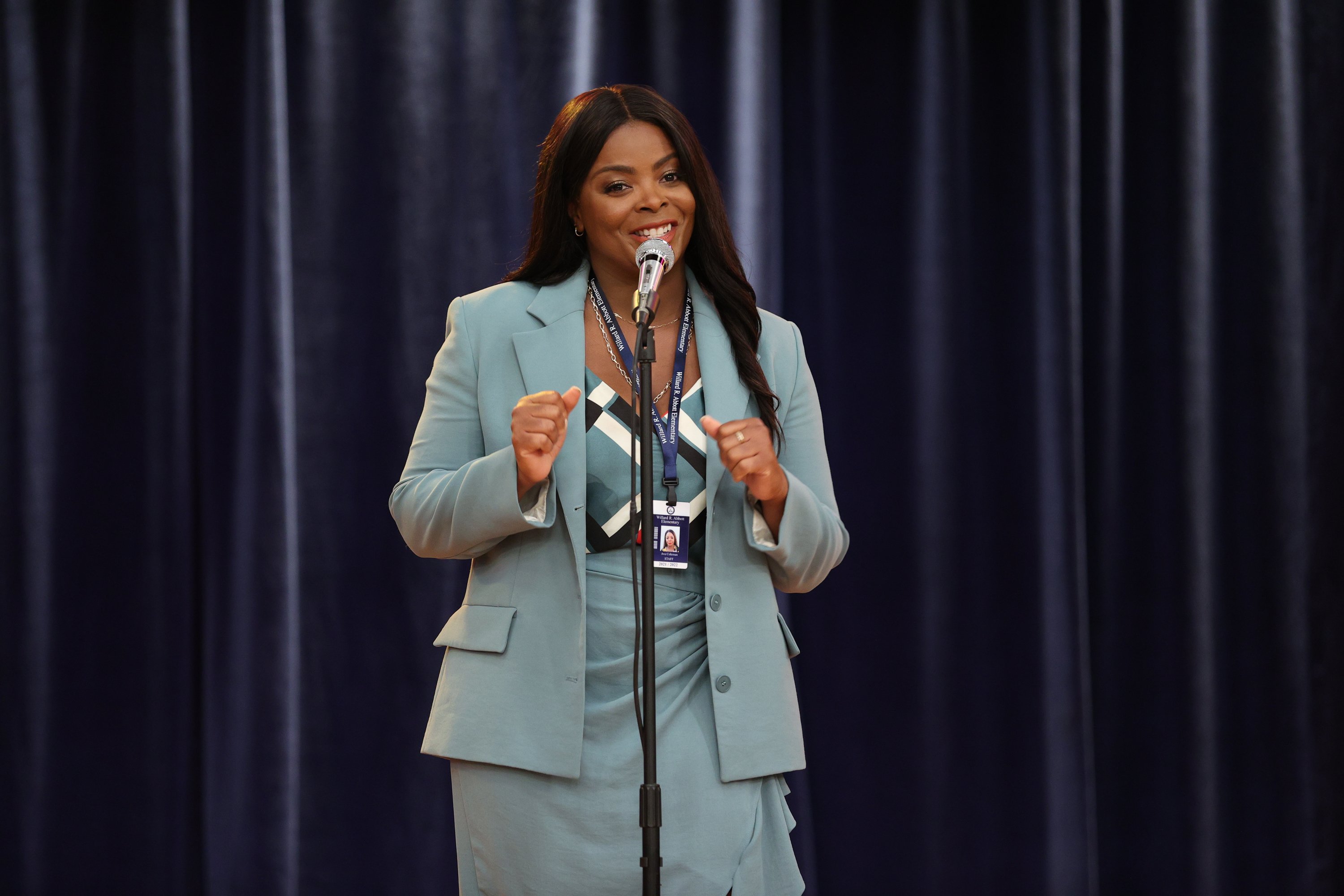 Janelle James as Principal Ava Coleman standing onstage on 'Abbott Elementary'