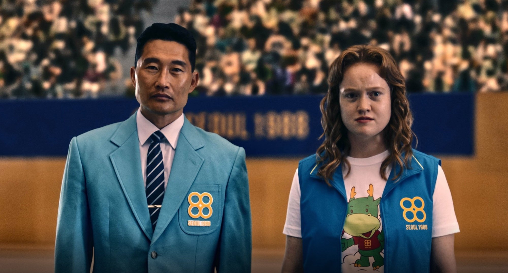 Actors Daniel Dae Kim and Liv Hewson in 'Dramaworld' Season 2 wearing blue jacket and vest.