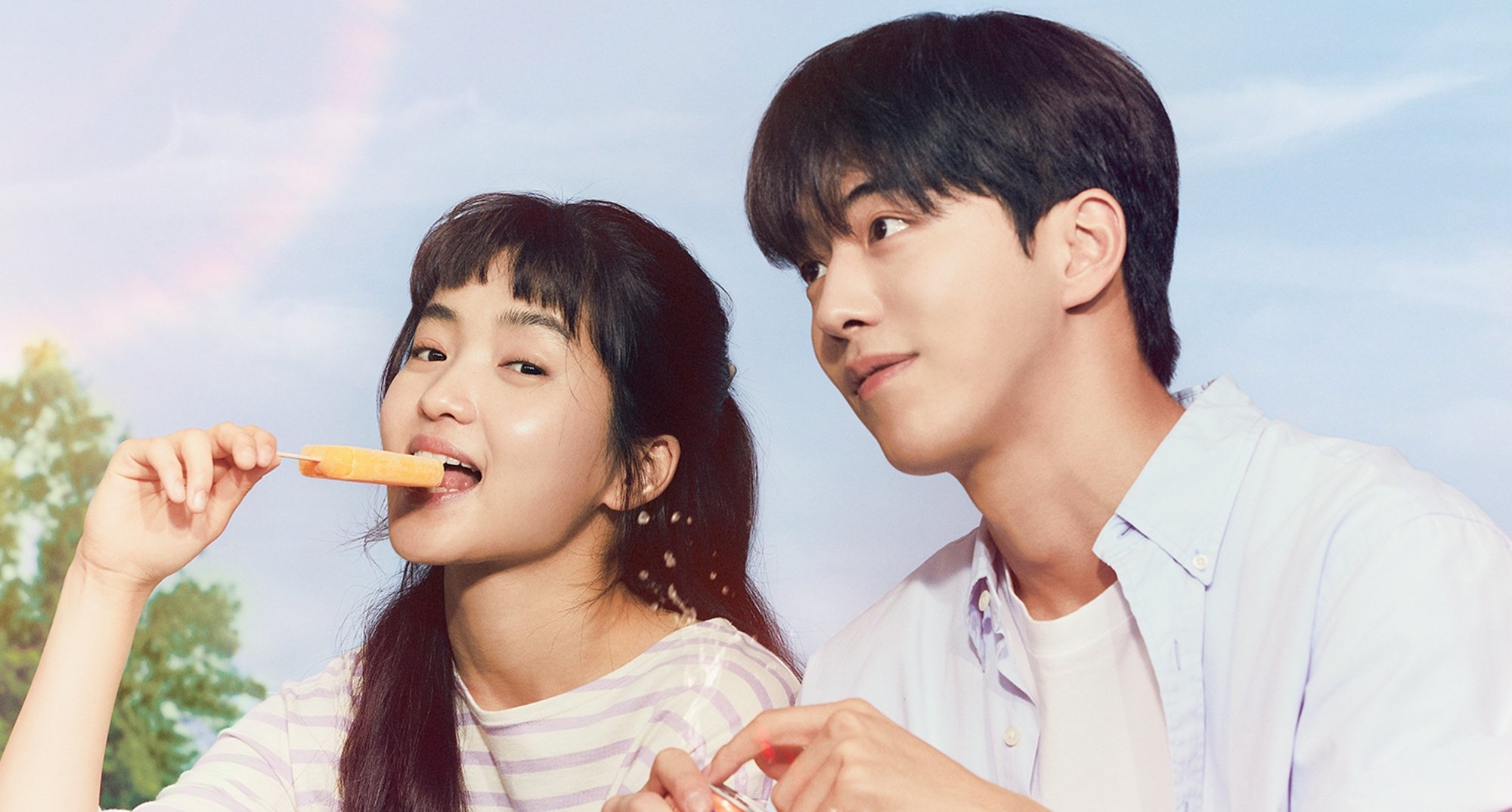 Actors Kim Tae-ri and Nam Joo-hyuk in 'Twenty-Five Twenty-One' K-drama and theory sitting together eating ice cream.