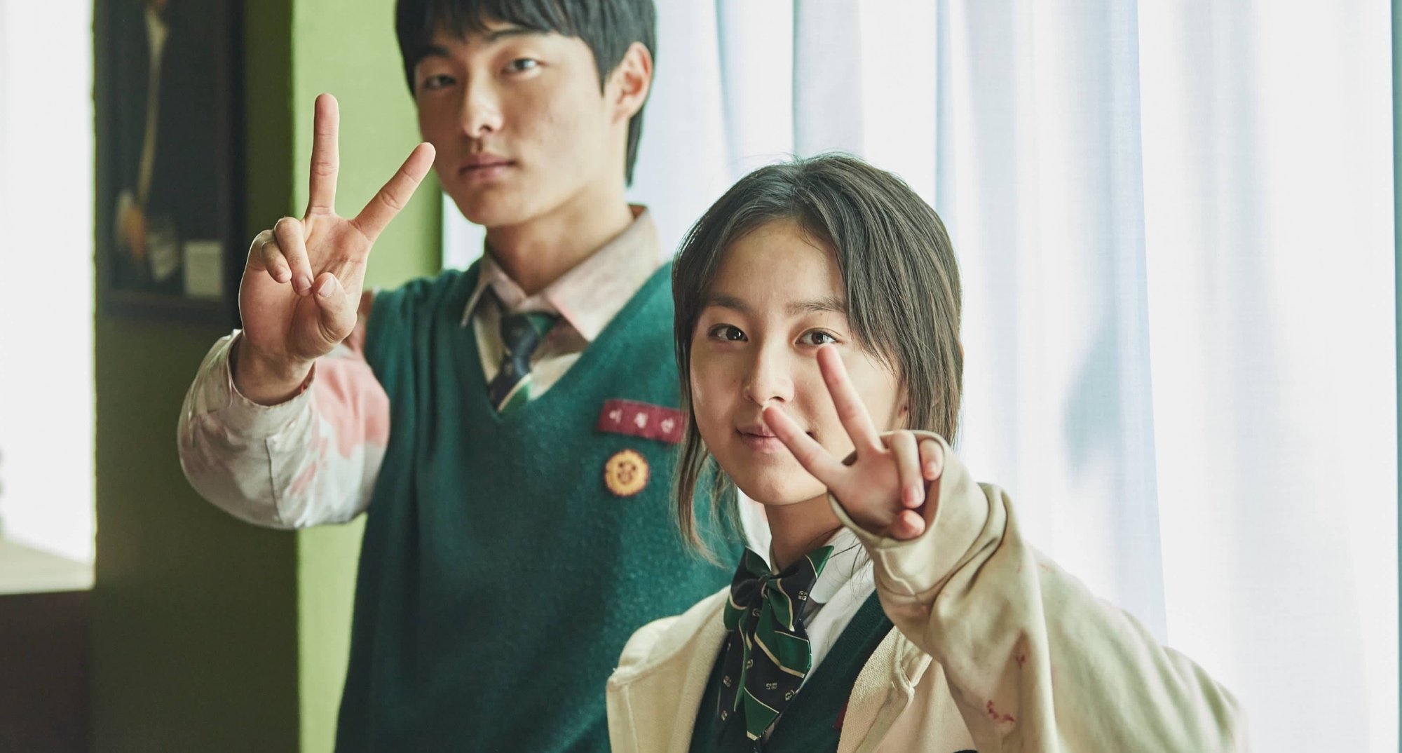 Actors Yoon Chan-young and Park Ji-hoo for 'All of Us Are Dead' wearing school uniforms in classroom
