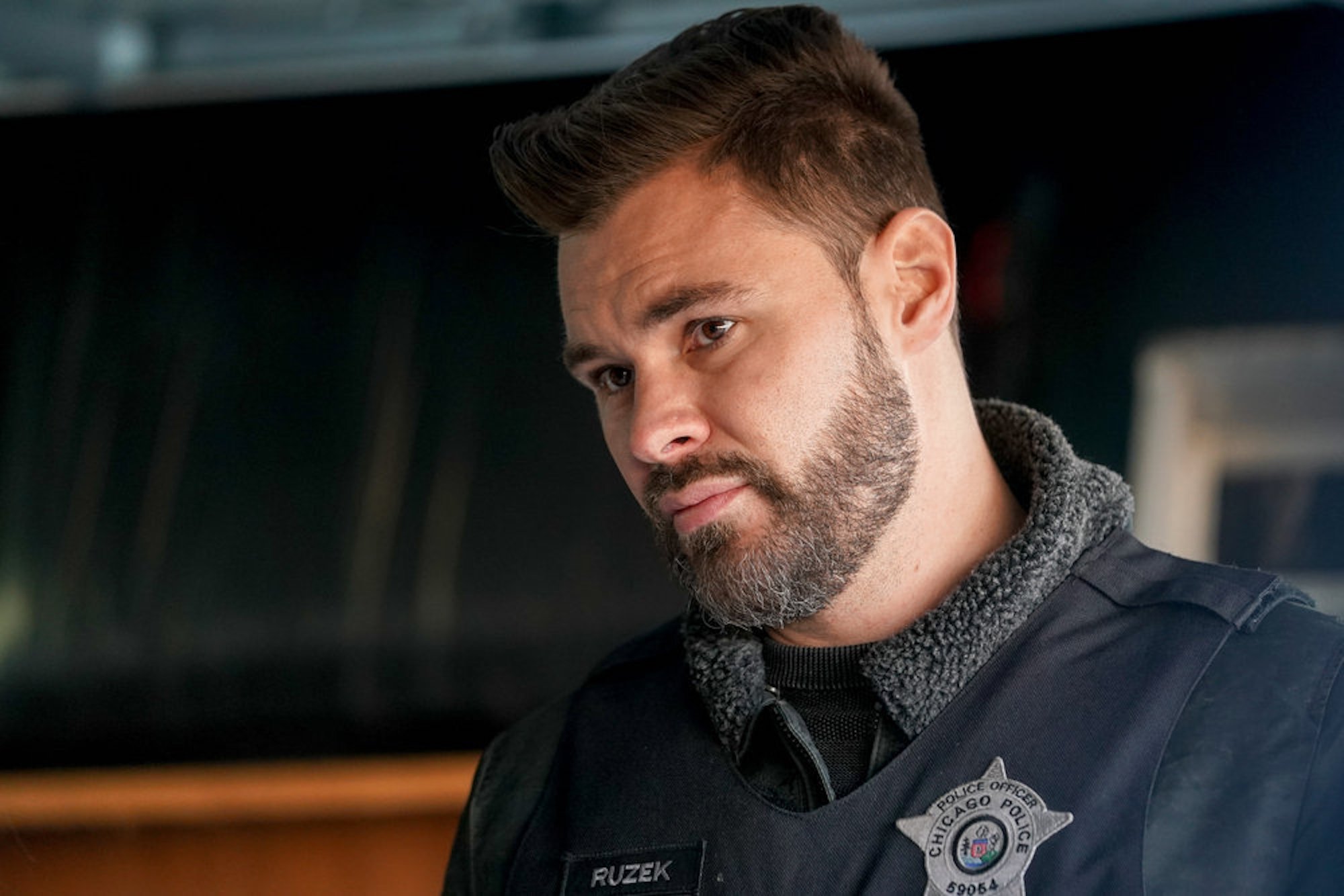 A close-up of Patrick John Flueger as Adam Ruzek in 'Chicago P.D.' Season 9