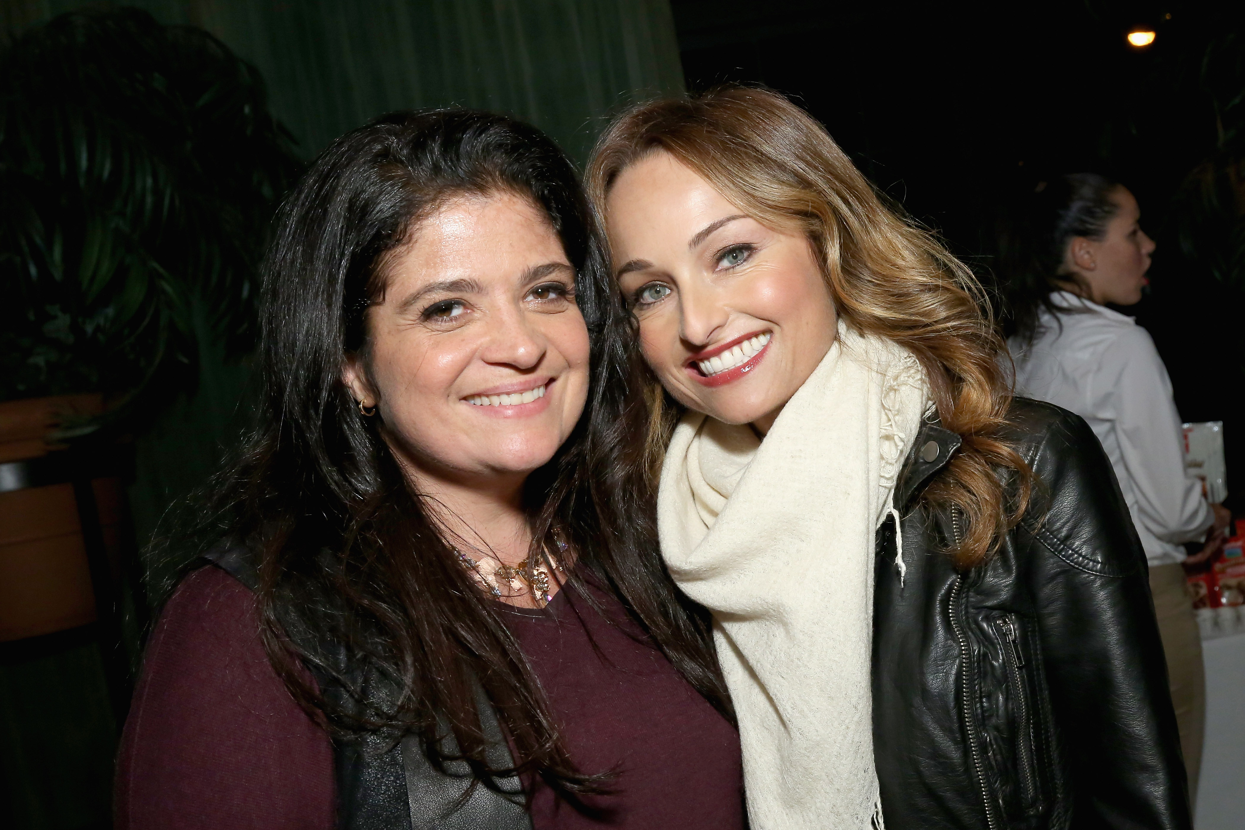 Food Network chefs Alex Guarnaschelli and Giada De Laurentiis smile for a photo during a 2015 Food Network event.