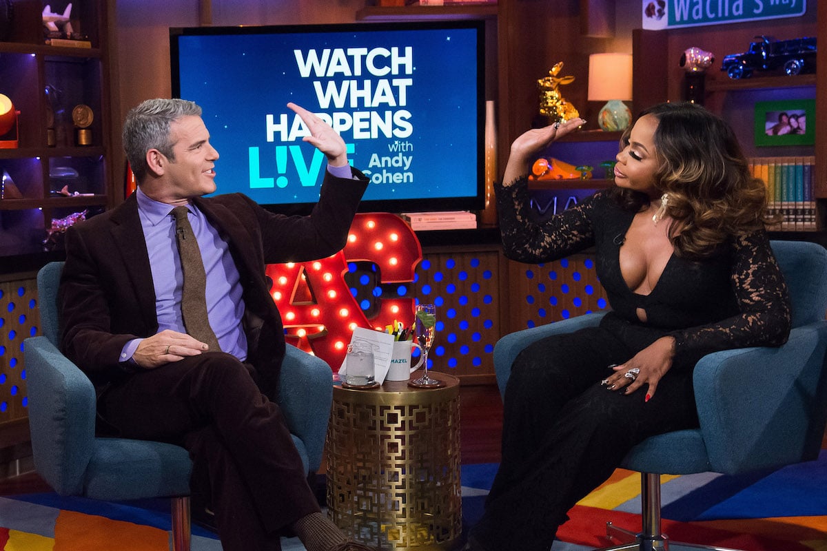 Andy Cohen and Phaedra Parks hi-five one another