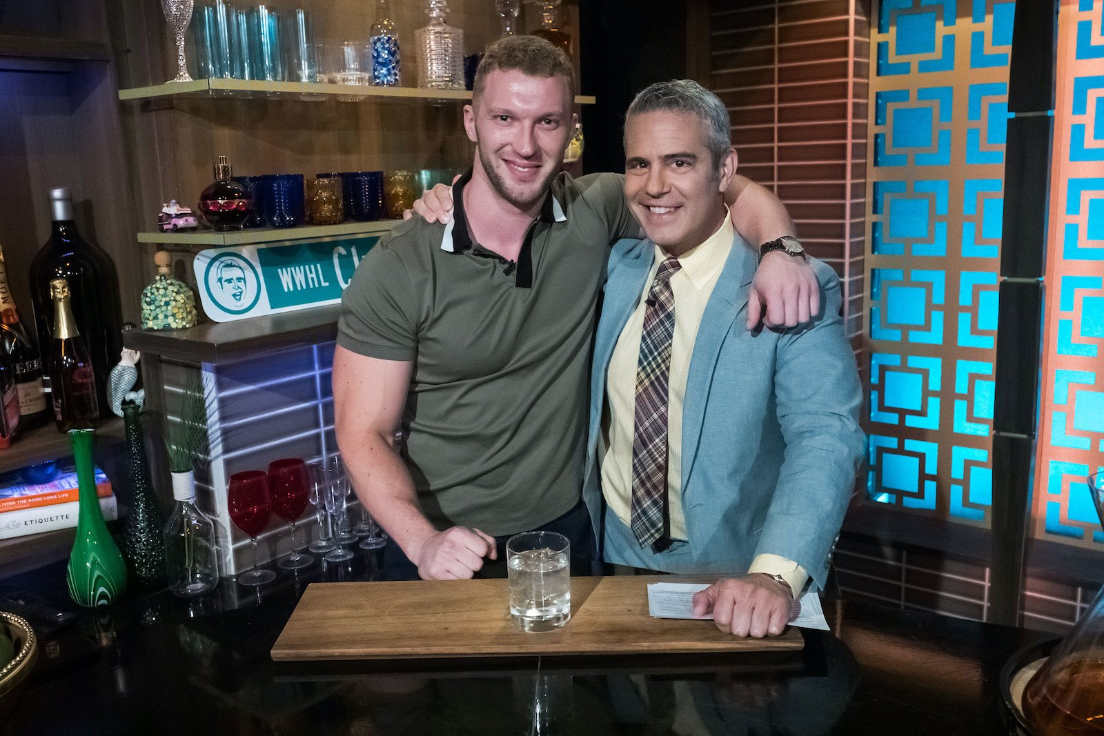 Andy Cohen and Stanislav Kravchenko behind the 'WWHL' bar
