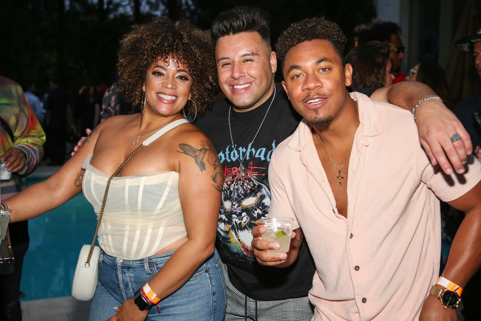 Reality TV personalities Aneesa Ferreira, Johnny Donovan, and Cameron Armstrong smiling while attending the Reality Rushmore: Paramount + MTV 'The Challenge' reunion event