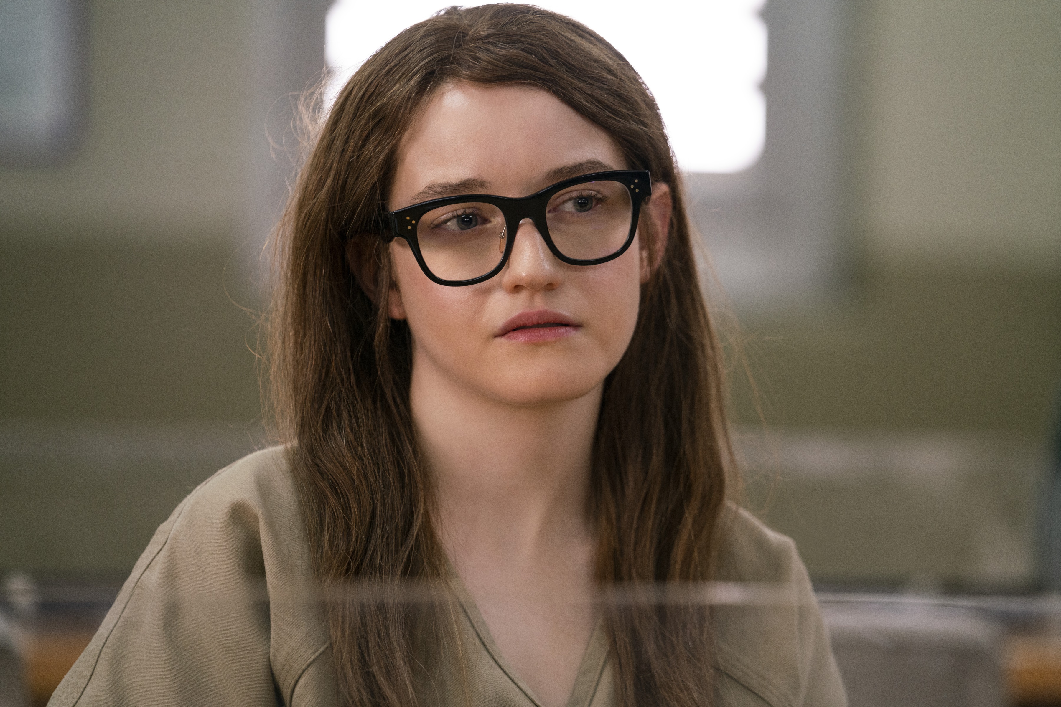 Julia Garner portraying Anna Sorokin in prison attire in Netflix's 'Inventing Anna'