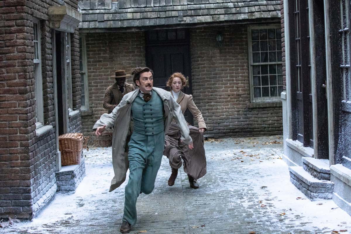 David Tennant as Phileas Fogg running in a snowy street in 'Around the World in 80 Days'