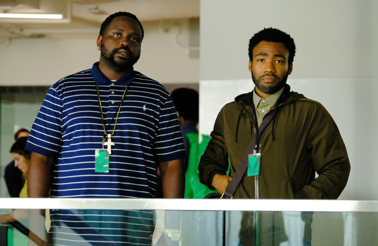 'Atlanta' stars Brian Tyree Henry and Donald Glover stand wearing lanyards