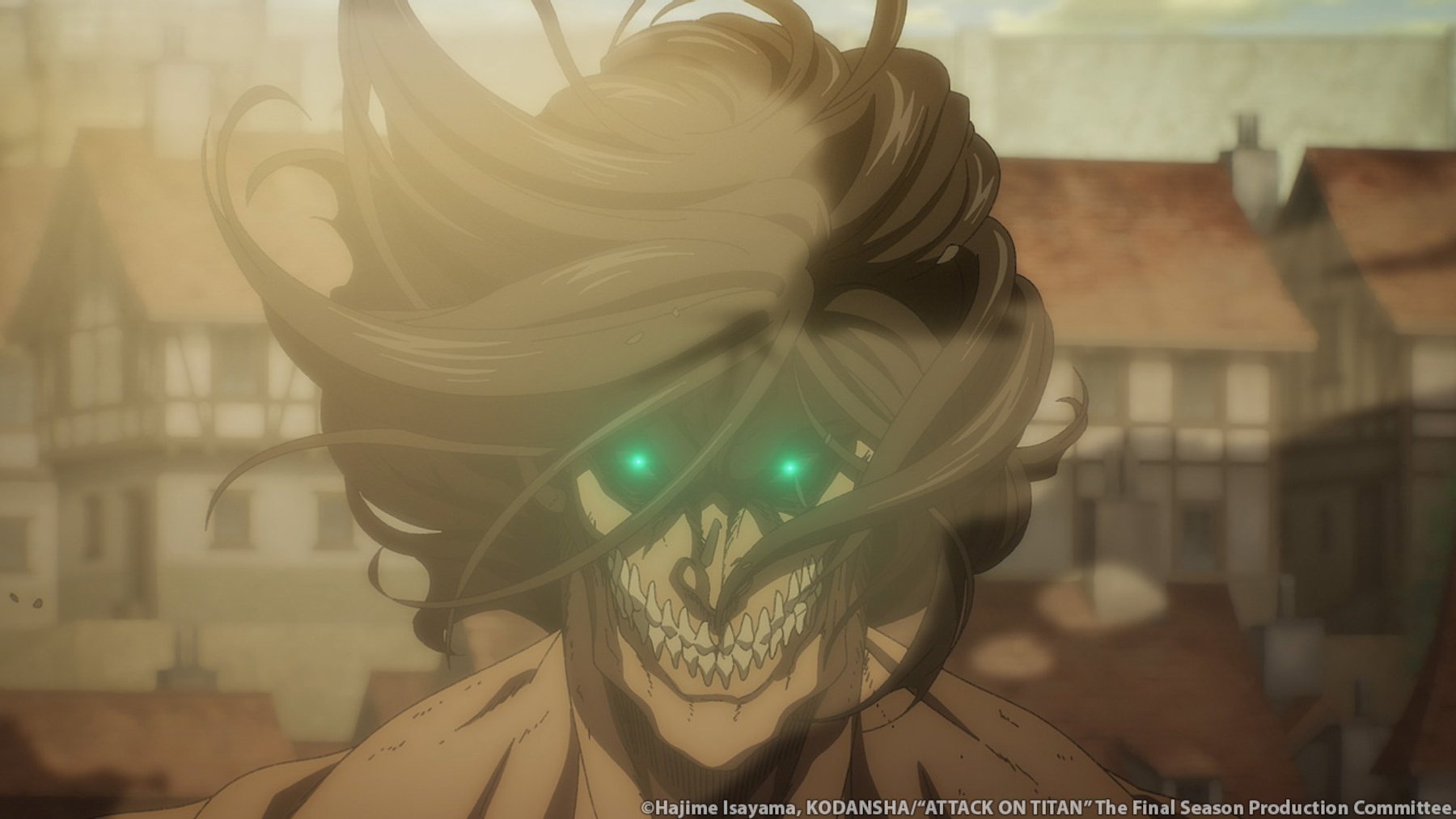 Eren Jaeger in Titan form in 'Attack on Titan' Season 4 Part 2. He's standing in front of buildings and his hair is blowing.