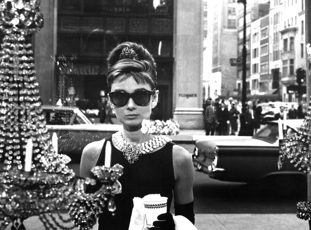 Actor Audrey Hepburn in 'Breakfast at Tiffany's' looking through a window