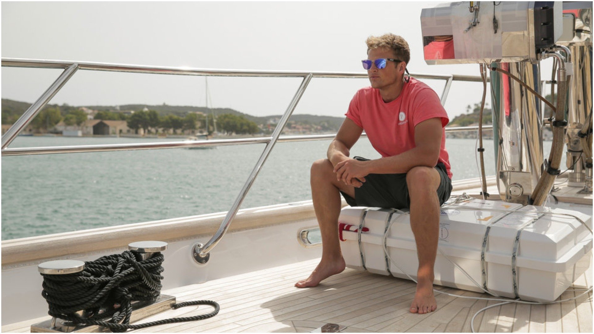 Tom Pearson from 'Below Deck Sailing Yacht' sits on deck 