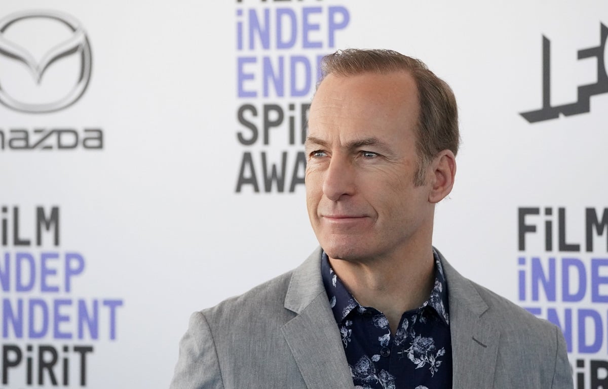 Bob Odenkirk smirking while wearing a suit.