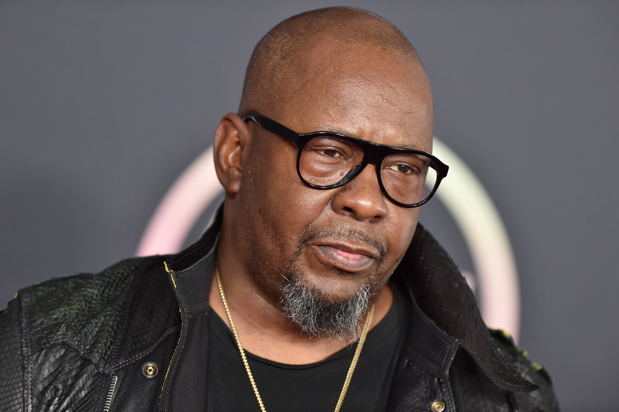 Bobby Brown wears glasses on the red carpet for the 2021 AMAs