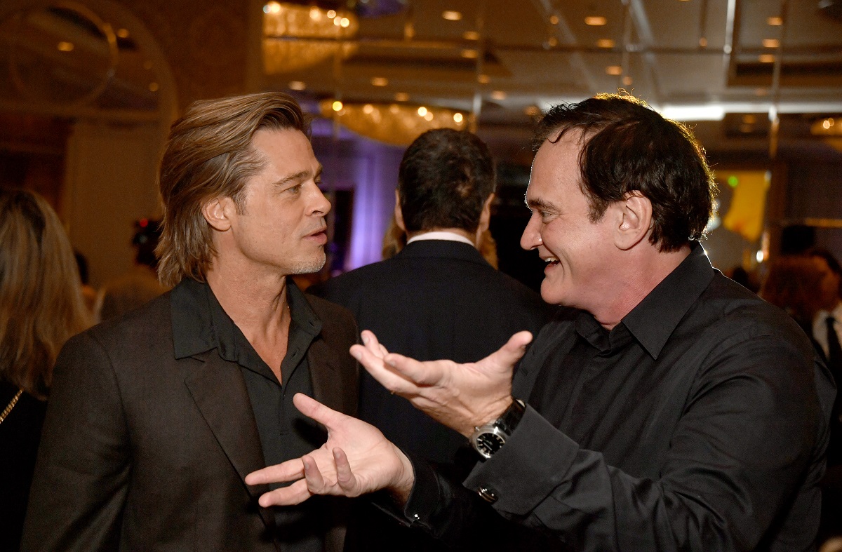 Brad Pitt talking to Quentin Tarantino