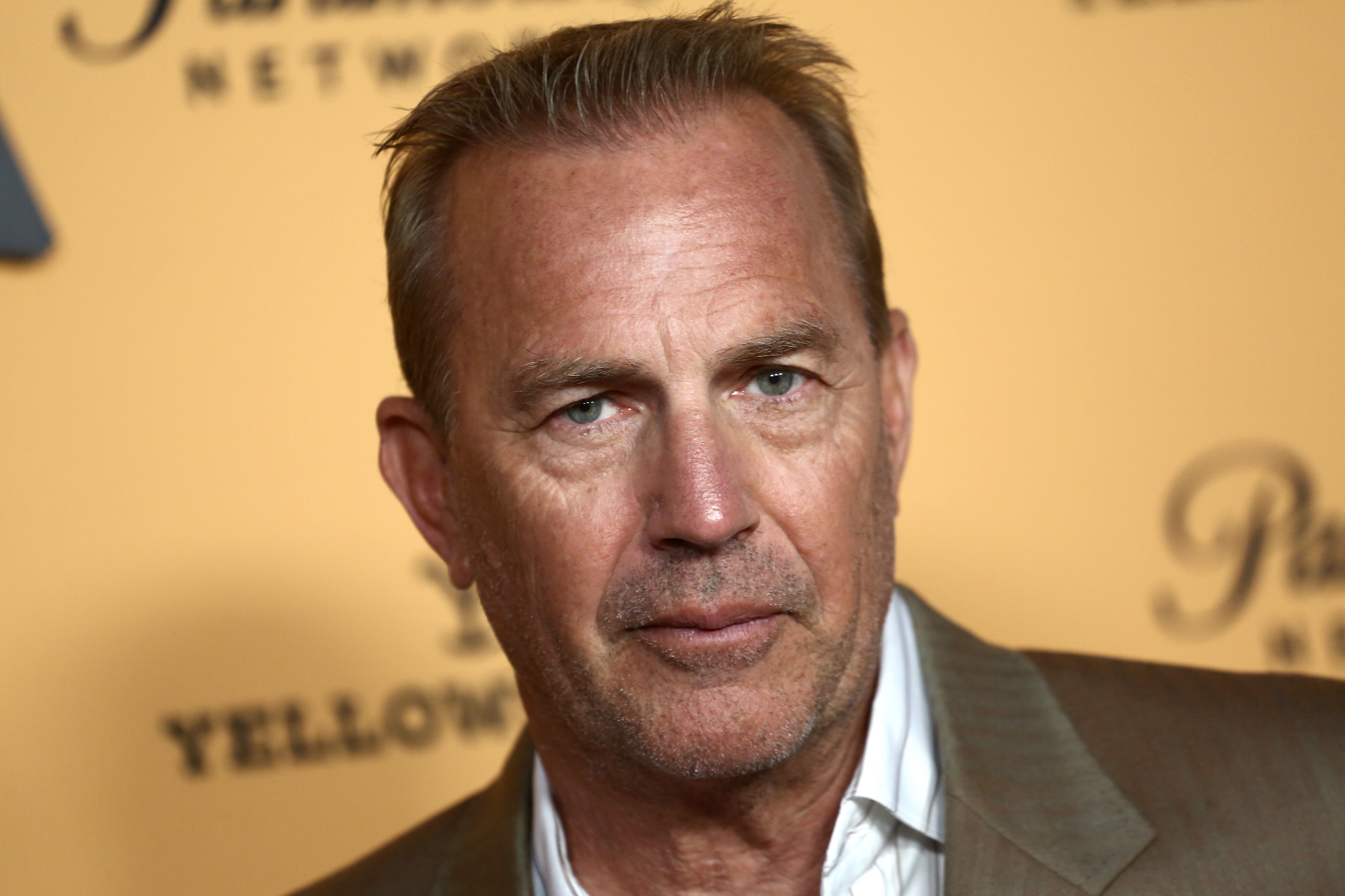 'Bull Durham' actor Kevin Costner standing in front of 'Yellowstone' step and repeat