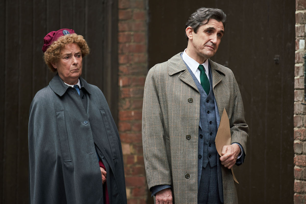 Nurse Crane and Dr. Turner, both wearing jackets and looking concerned, in 'Call the Midwife' Season 11
