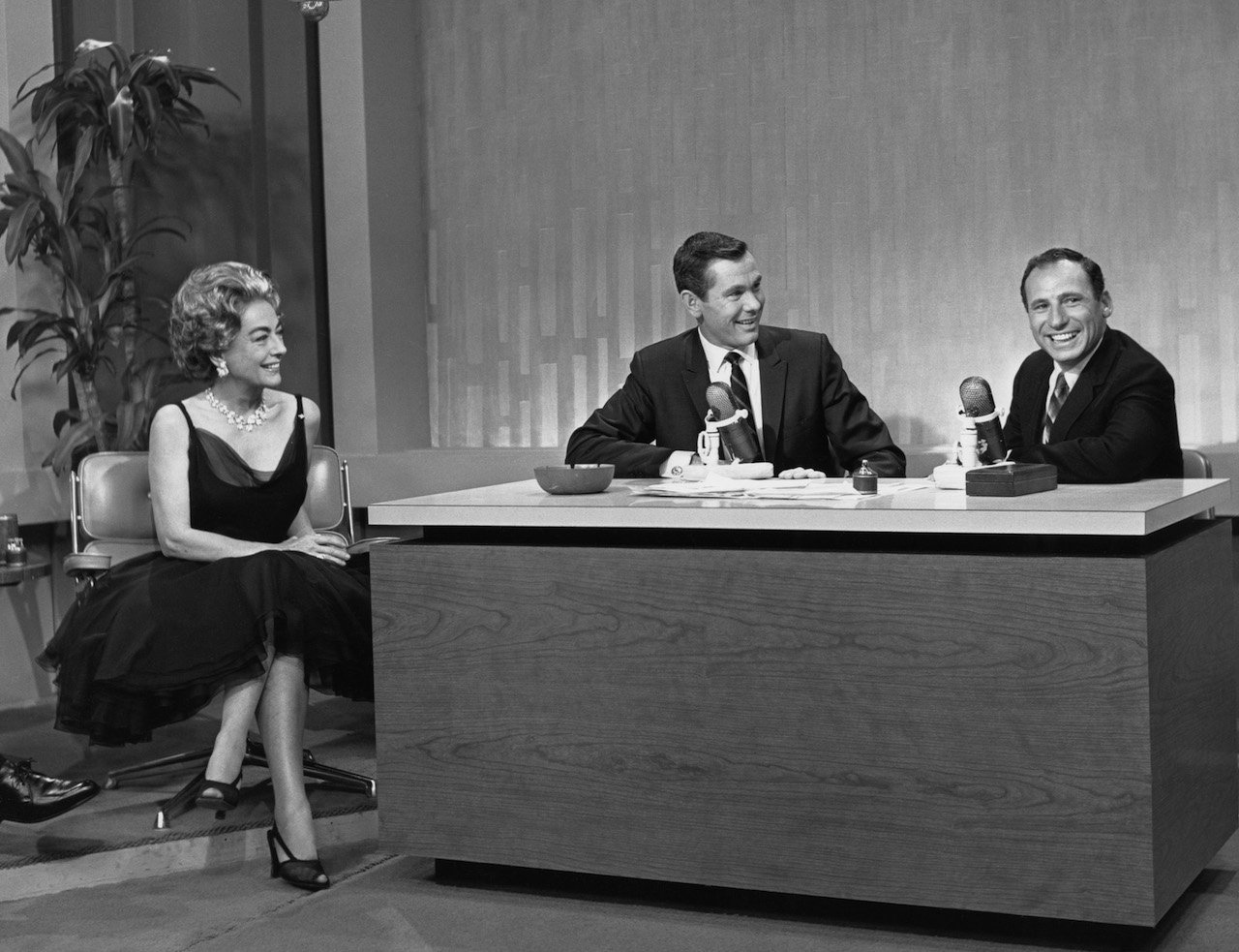 (l-r) Joan Crawford, host Johnny Carson, and Mel Brooks on the premiere episode of "The Tonight Show Starring Johnny Carson" on October 1, 1962