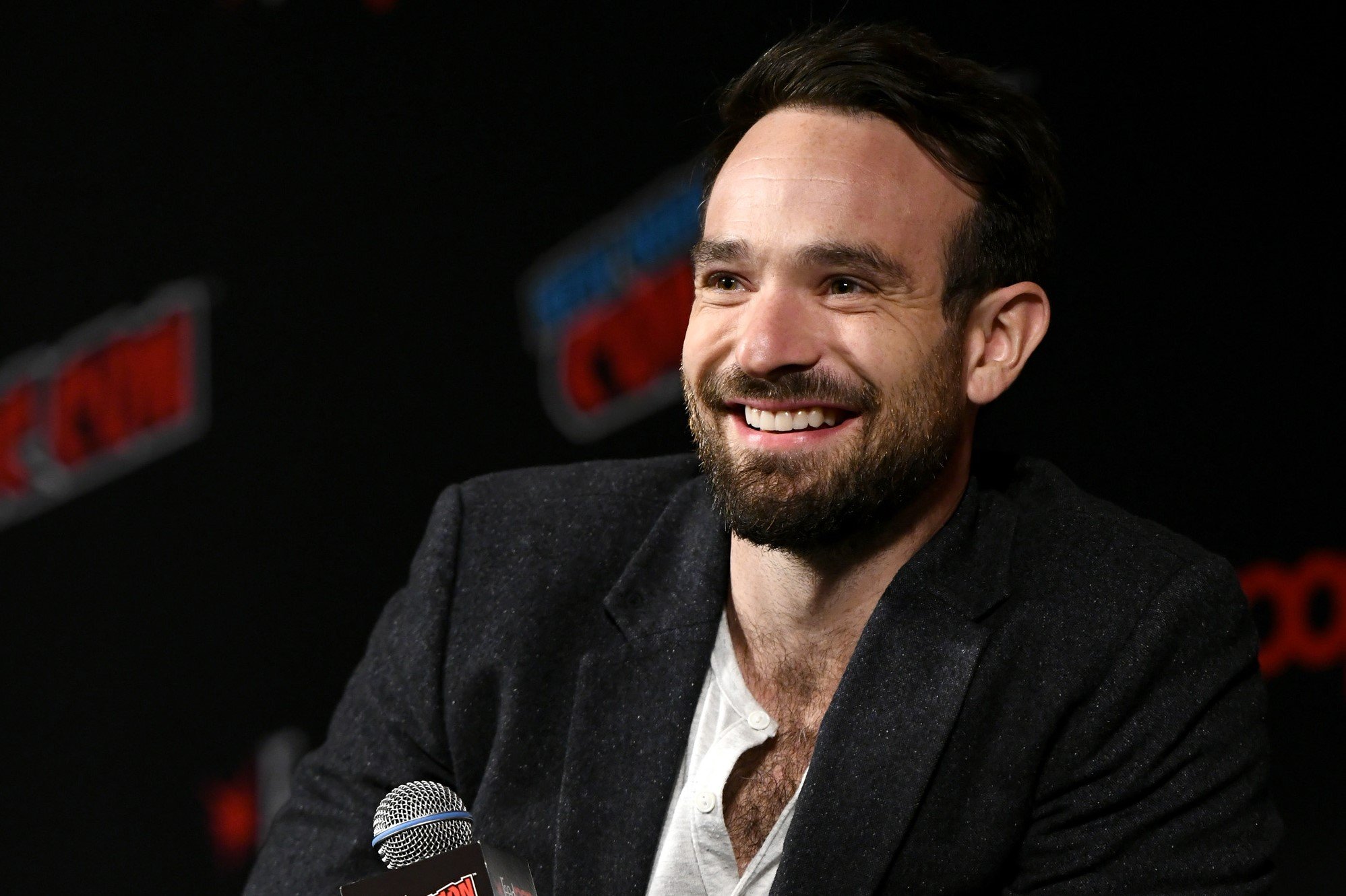 'Spider-Man: No Way Home' actor Charlie Cox wears a black suit over a white shirt.