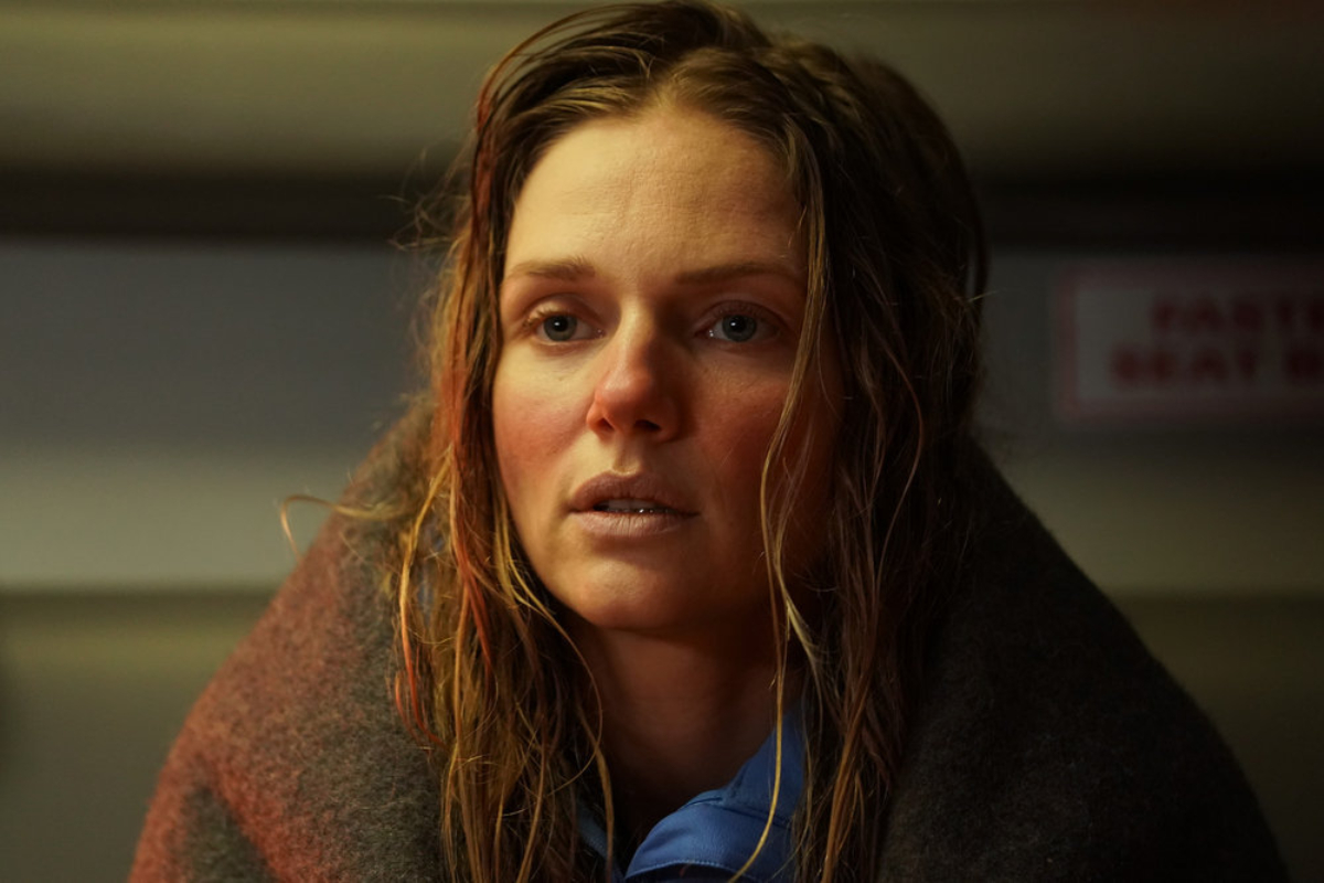 Tracy Spiridakos as Hailey in Chicago P.D. Season 9. Upton has damp hair. Her cheeks are pink and she looks cold. 
