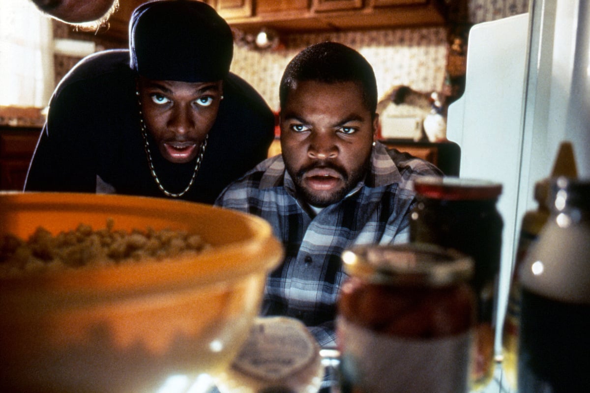 Chris Tucker and Ice Cube look into a refrigerator in ‘Friday’